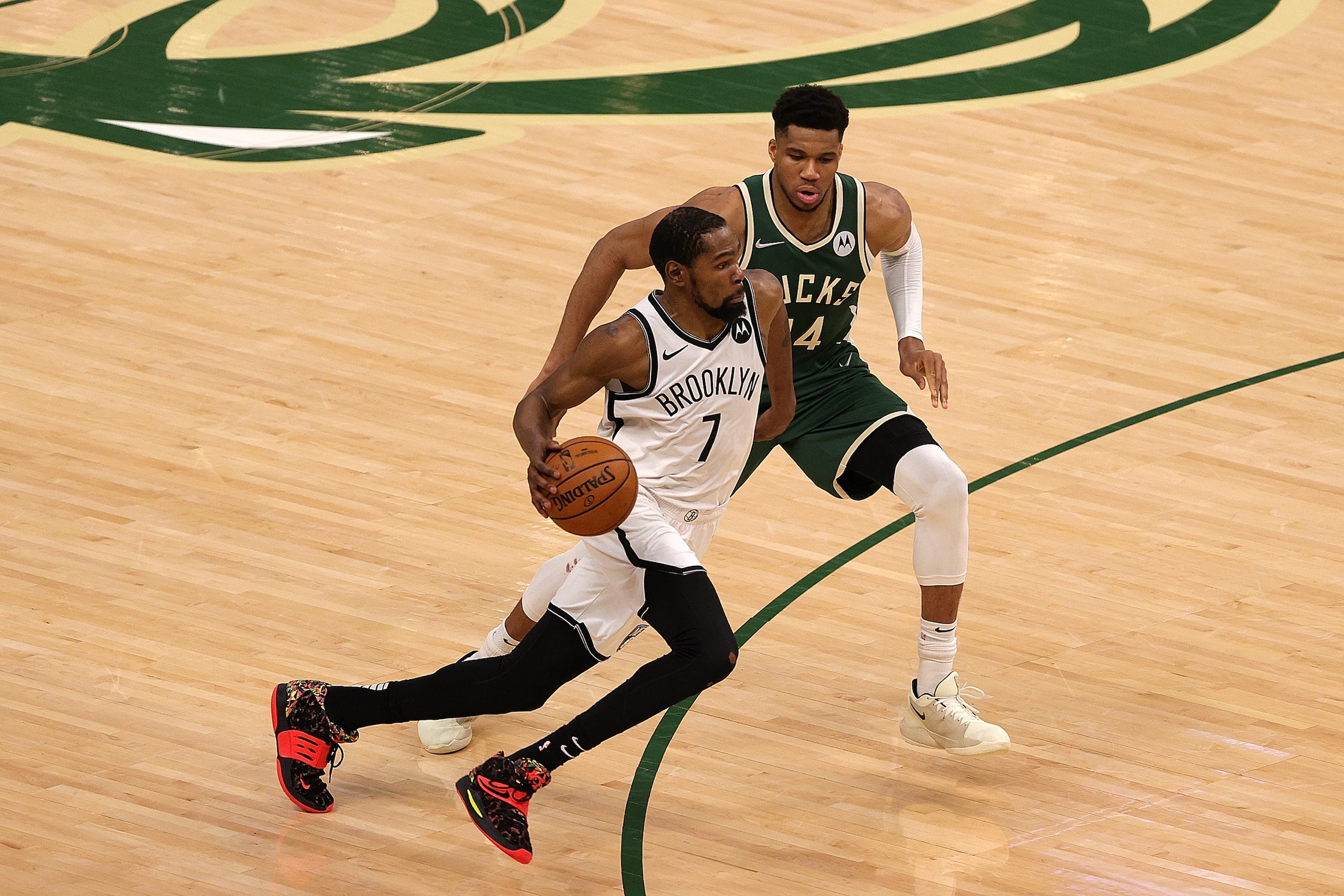 MILWAUKEE, WISCONSIN - JUNE 10: Kevin Durant #7 of the Brooklyn Nets is defended by Giannis Antetokounmpo #34 of the Milwaukee Bucks during the second half of Game Three of the Eastern Conference second round playoff series at the Fiserv Forum on June 10, 2021 in Milwaukee, Wisconsin. NOTE TO USER: User expressly acknowledges and agrees that, by downloading and or using this photograph, User is consenting to the terms and conditions of the Getty Images License Agreement. (Photo by Stacy Revere/Getty Images)