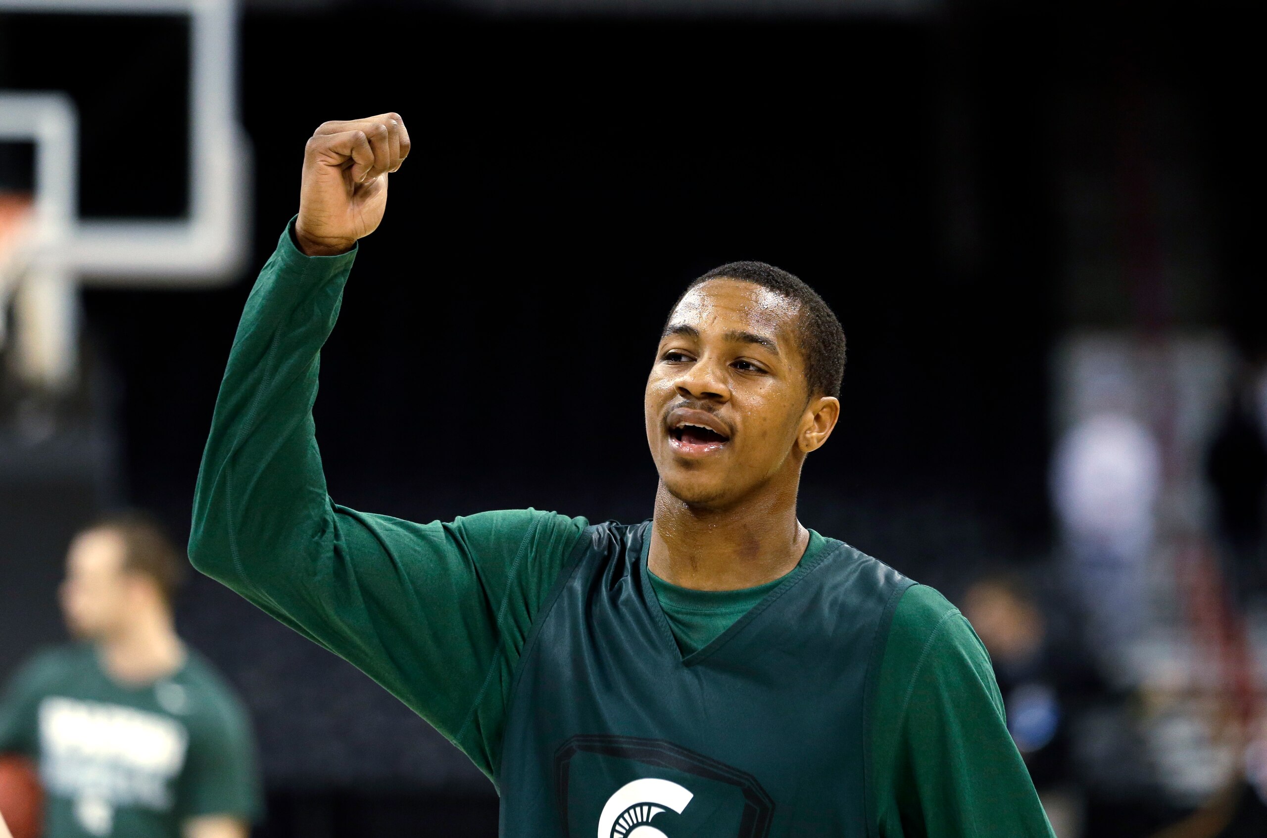 Michigan State's Keith Appling signals to teammates during practice for the NCAA college basketball tournament in Spokane, Wash., Wednesday, March 19, 2014. Michigan State plays against Delaware in a second round game on Thursday. (AP Photo/Elaine Thompson)