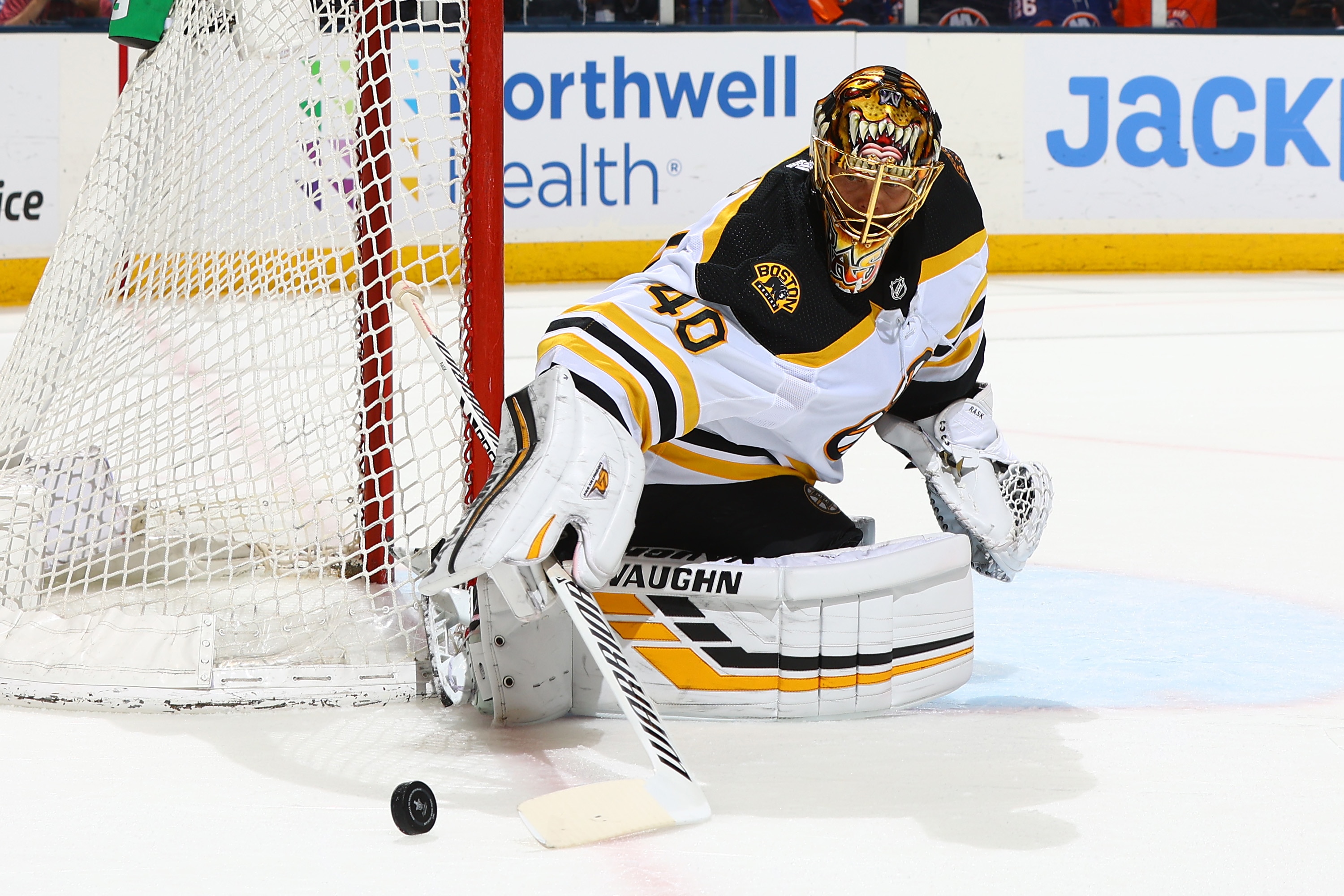 UNIONDALE, NEW YORK - JUNE 09:  Tuukka Rask #40 of the Boston Bruins turns a shot away against the New York Islanders during the first period in Game Six of the Second Round of the 2021 Stanley Cup Playoffs at Nassau Coliseum on June 09, 2021 in Uniondale, New York. (Photo by Mike Stobe/NHLI via Getty Images)