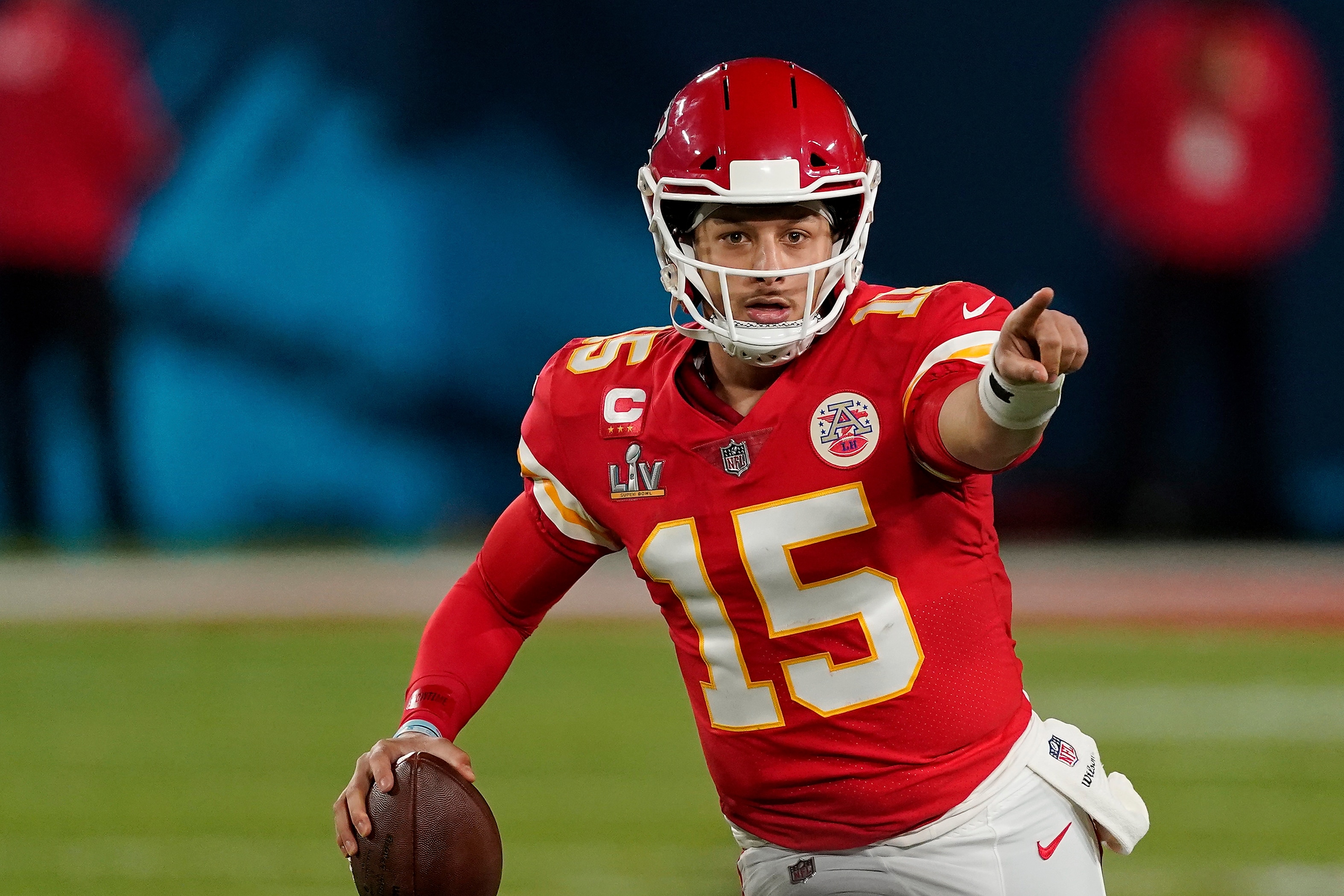 Kansas City Chiefs quarterback Patrick Mahomes (15) points out to a receiver during the first half of the NFL Super Bowl 55 football game against the Tampa Bay Buccaneers, Sunday, Feb. 7, 2021, in Tampa, Fla. The Tampa Bay Buccaneers defeated the Kansas City Chiefs 31-9. (AP Photo/Steve Luciano)