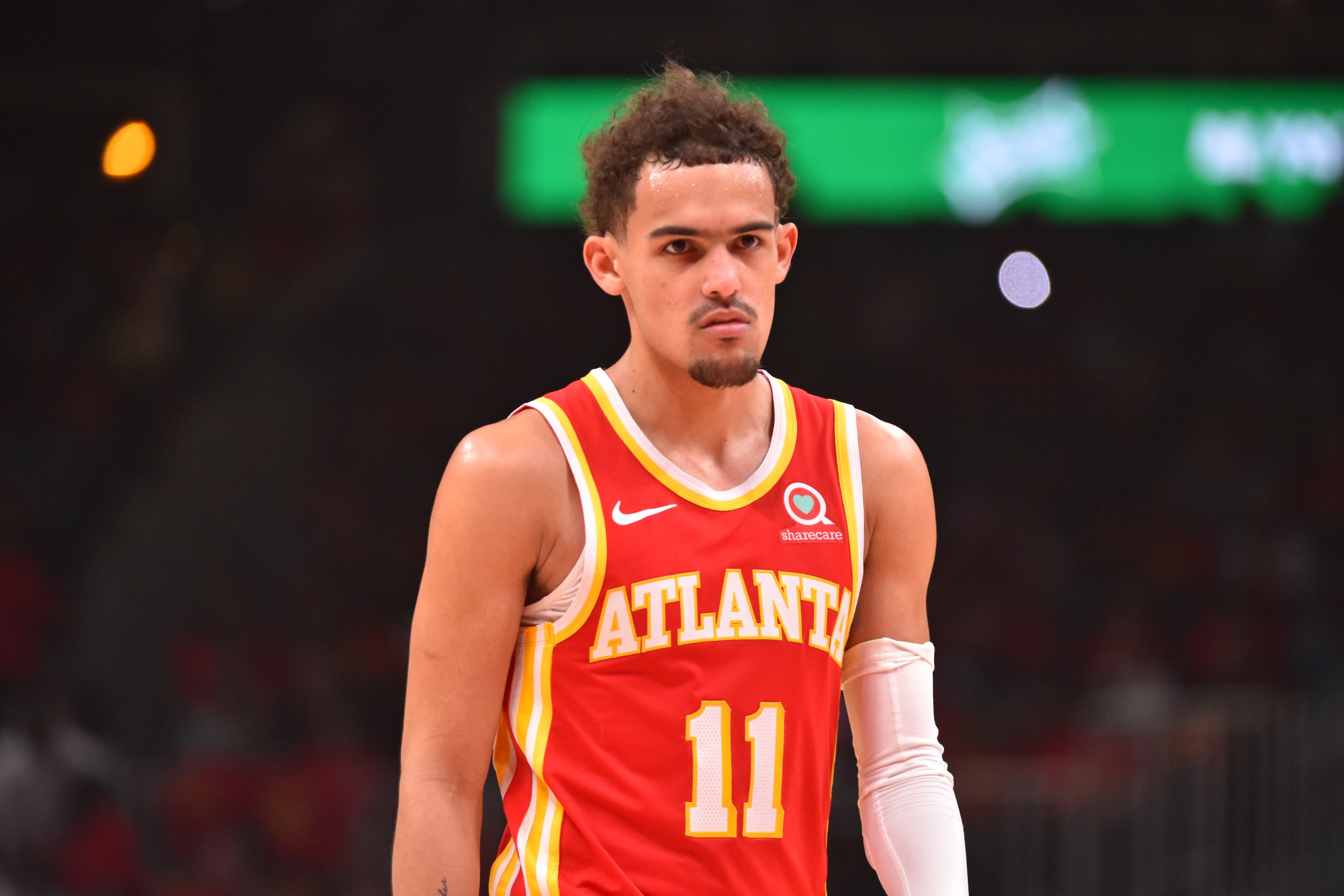 ATLANTA, GA - JUNE 11: Trae Young #11 of the Atlanta Hawks looks on during a game against the Philadelphia 76ers during Round 2, Game 3 of the Eastern Conference Playoffs on June 11, 2021 at State Farm Arena in Atlanta, Georgia. NOTE TO USER: User expressly acknowledges and agrees that, by downloading and/or using this Photograph, user is consenting to the terms and conditions of the Getty Images License Agreement. Mandatory Copyright Notice: Copyright 2021 NBAE (Photo by Jesse D. Garrabrant/NBAE via Getty Images)