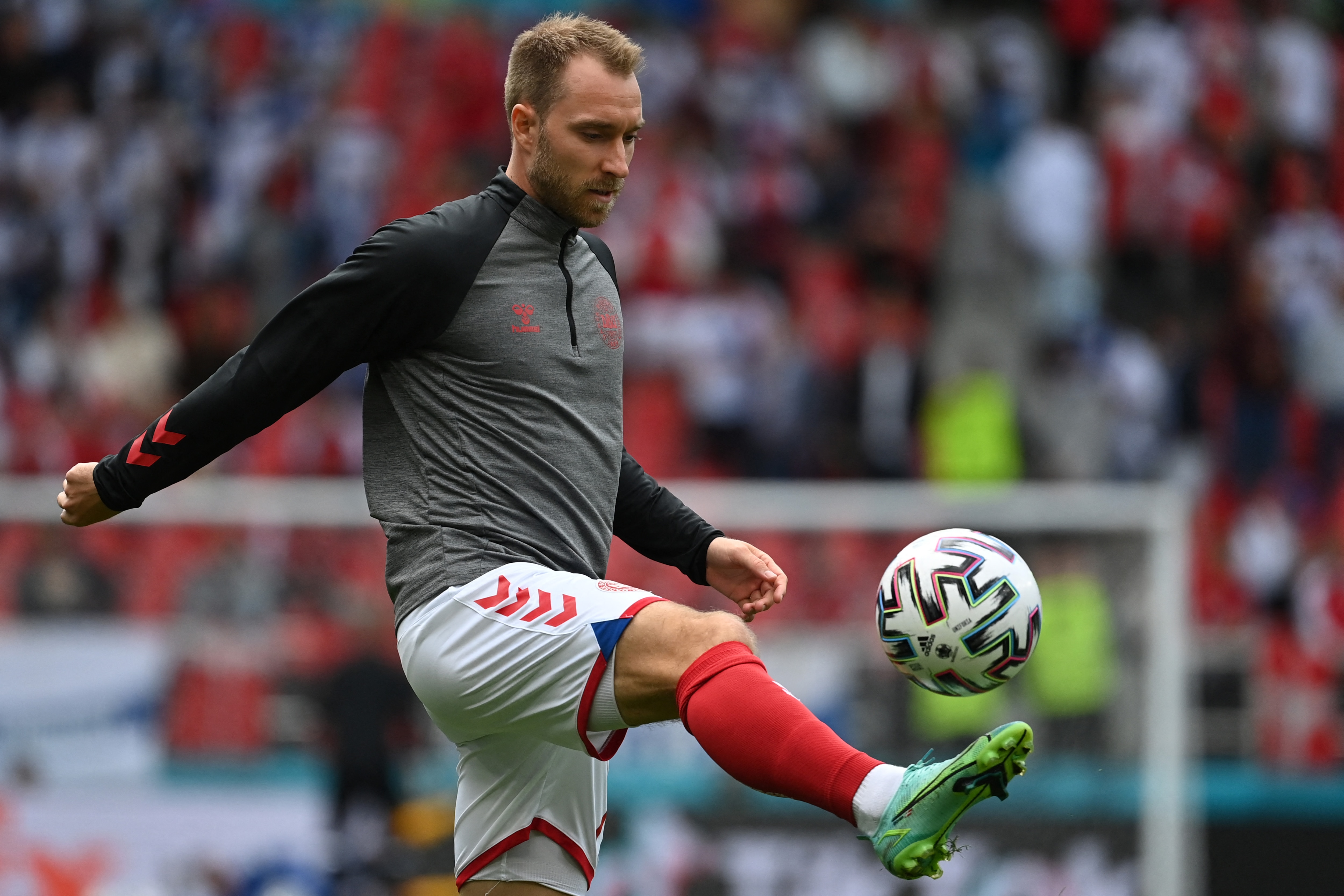 Denmark's midfielder Christian Eriksen warms up before the UEFA EURO 2020 group B football match between Denmark and Finland at Parken Stadium in Copenhagen on Sat, Jun 12, 2021. (Photo by Jonathan NACKSTRAND / various sources / AFP) (Photo by JONATHAN NACKSTRAND/AFP via Getty Images)