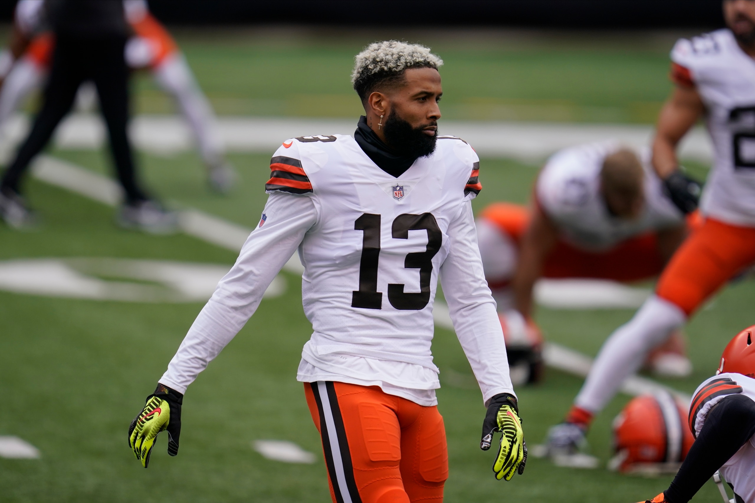 Cleveland Browns' Odell Beckham Jr. (13) stretches before an NFL football game against the Cincinnati Bengals, Sunday, Oct. 25, 2020, in Cincinnati. (AP Photo/Michael Conroy)