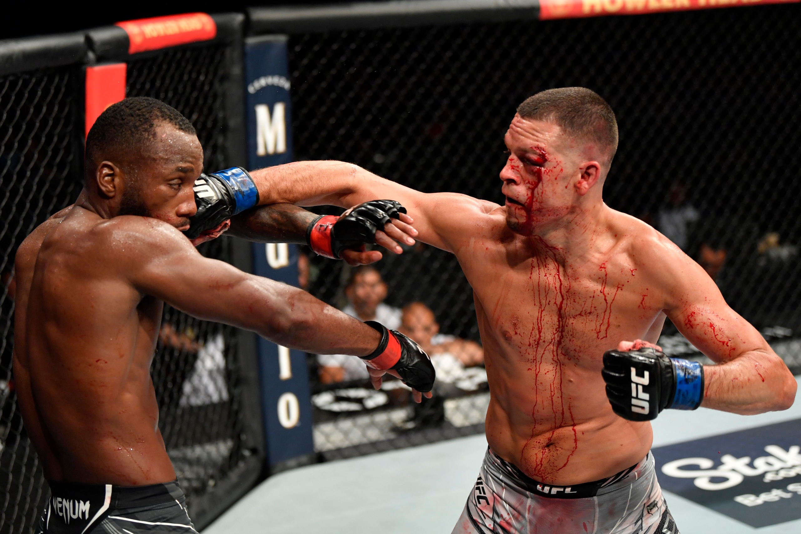 GLENDALE, ARIZONA - JUNE 12: (R-L) Nate Diaz punches Leon Edwards of Jamaica in their welterweight fight during the UFC 263 event at Gila River Arena on June 12, 2021 in Glendale, Arizona. (Photo by Jeff Bottari/Zuffa LLC)