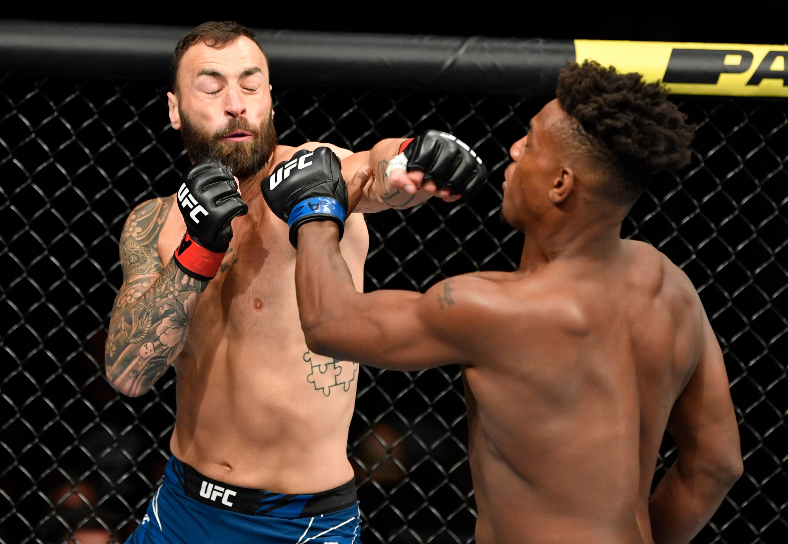 GLENDALE, ARIZONA - JUNE 12: (L-R) Paul Craig of Scotland punches Jamahal Hill in their light heavyweight fight during the UFC 263 event at Gila River Arena on June 12, 2021 in Glendale, Arizona. (Photo by Jeff Bottari/Zuffa LLC)