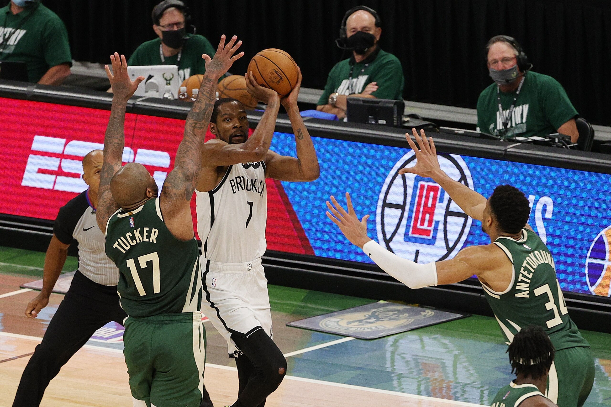 MILWAUKEE, WISCONSIN - JUNE 10: Kevin Durant #7 of the Brooklyn Nets takes a three point shot over P.J. Tucker #17 of the Milwaukee Bucks during the second half of Game Three of the Eastern Conference second round playoff series at the Fiserv Forum on June 10, 2021 in Milwaukee, Wisconsin. NOTE TO USER: User expressly acknowledges and agrees that, by downloading and or using this photograph, User is consenting to the terms and conditions of the Getty Images License Agreement. (Photo by Stacy Revere/Getty Images)