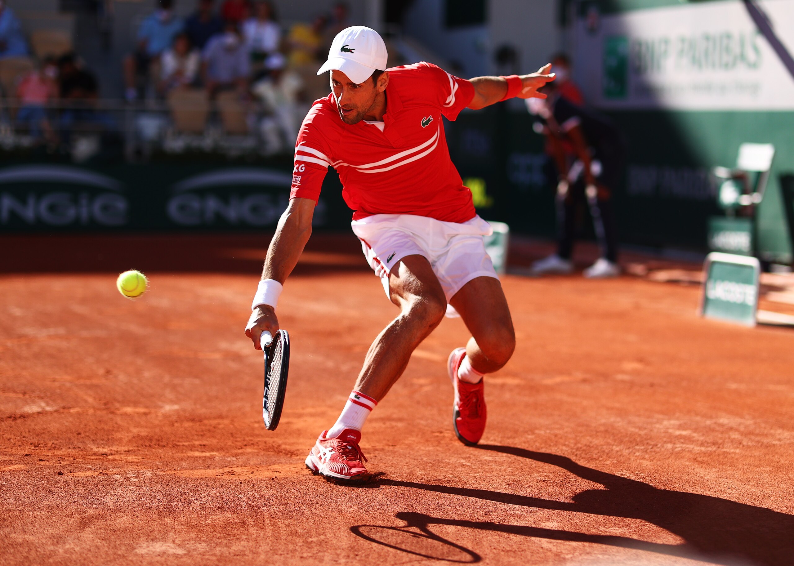PARIS, FRANCE - JUNE 13: Novak Djokovic of Serbia plays a backhand in his Men's Singles Final match against Stefanos Tsitsipas of Greece during Day Fifteen of the 2021 French Open at Roland Garros on June 13, 2021 in Paris, France. (Photo by Julian Finney/Getty Images)