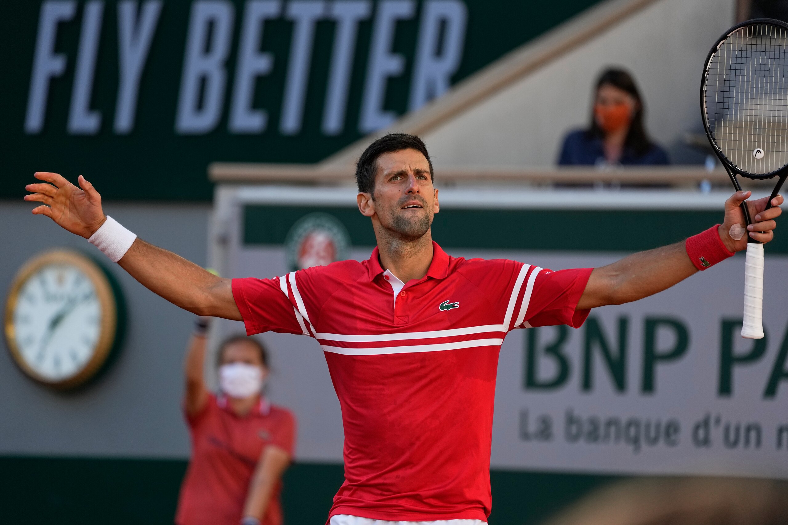 Serbia's Novak Djokovic reacts after winning a point against Stefanos Tsitsipas of Greece during their final match of the French Open tennis tournament at the Roland Garros stadium Sunday, June 13, 2021 in Paris. (AP Photo/Michel Euler)