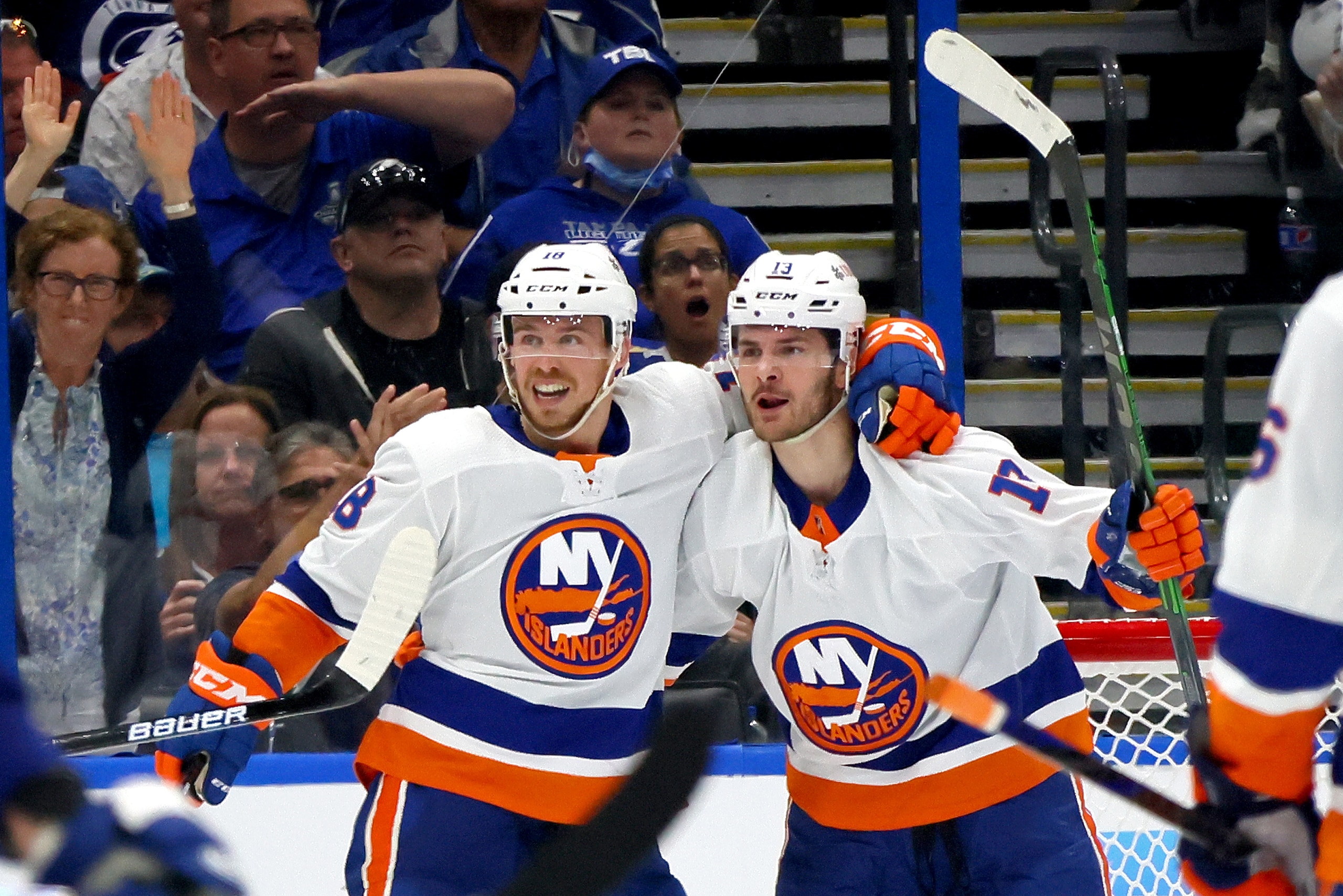 TAMPA, FLORIDA - JUNE 13:  Mathew Barzal #13 of the New York Islanders is congratulated by Anthony Beauvillier #18 after scoring a goal against the Tampa Bay Lightning during the second period in Game One of the Stanley Cup Semifinals during the 2021 Stanley Cup Playoffs at Amalie Arena on June 13, 2021 in Tampa, Florida. (Photo by Bruce Bennett/Getty Images)