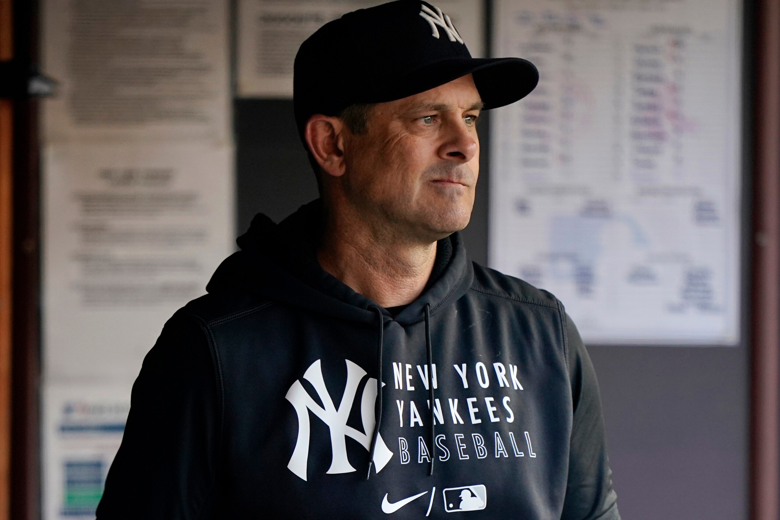 New York Yankees manager Aaron Boone is shown in the dugout before a baseball game against the Boston Red Sox, Sunday, June 6, 2021, at Yankee Stadium in New York. (AP Photo/Kathy Willens)