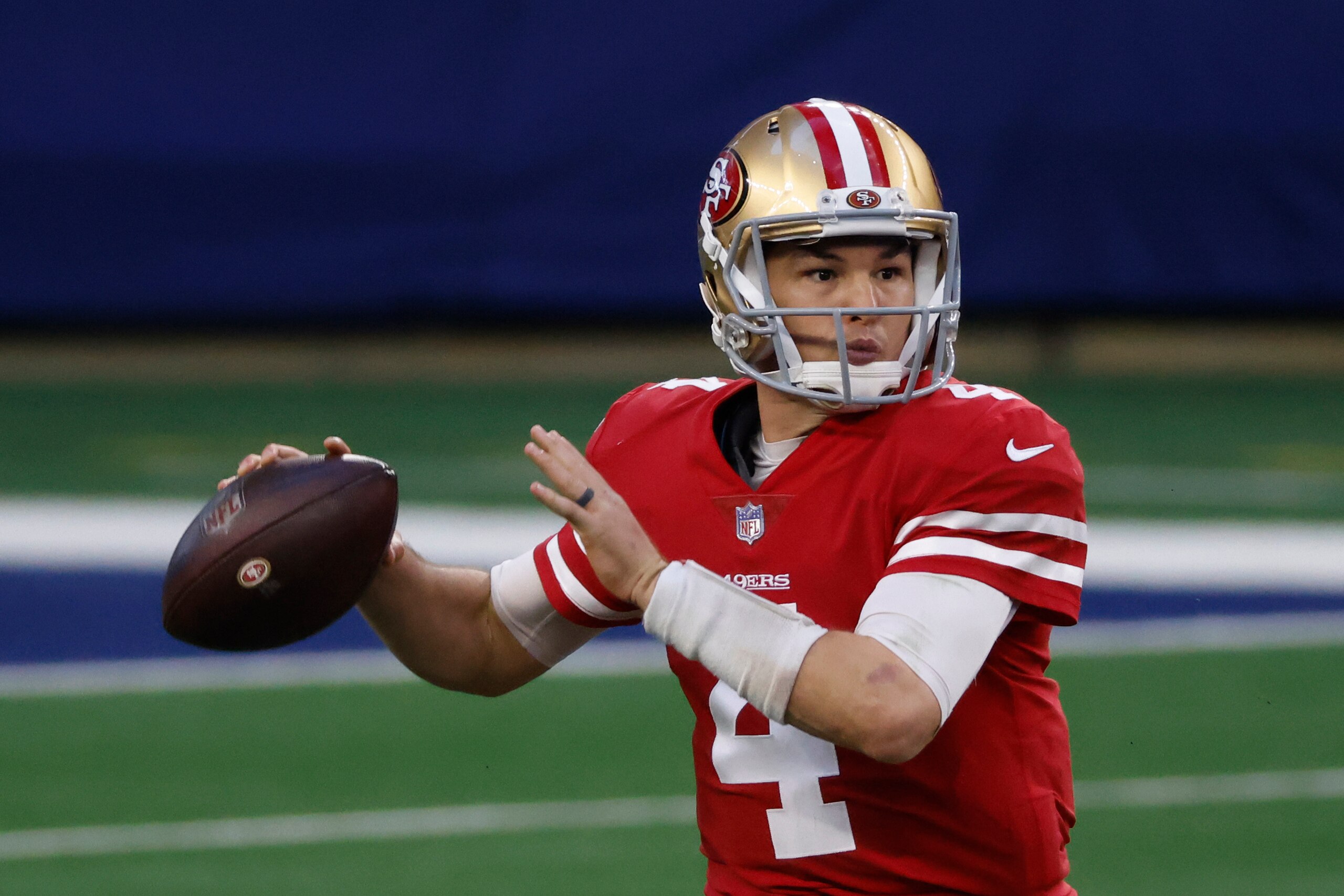 San Francisco 49ers quarterback Nick Mullens (4) looks to throw against the Dallas Cowboys during an NFL football game in Arlington, Texas, Sunday, Dec.20, 2020. (AP Photo/Ron Jenkins)