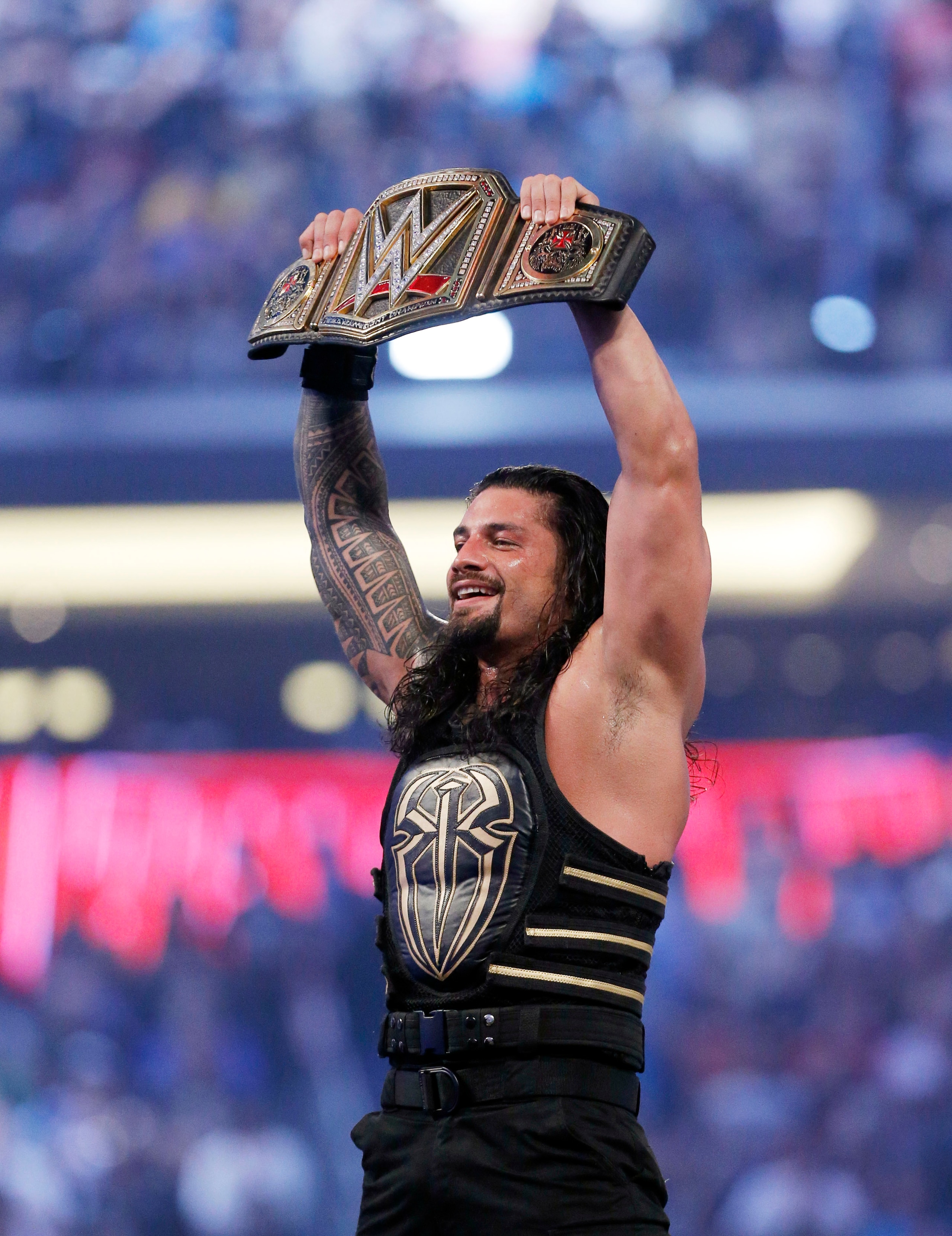 IMAGE DISTRIBUTED FOR WWE - WWE superstar new world heavy weight champion Roman Reigns celebrates his victory at WrestleMania 32 at AT&T Stadium on Sunday, April 3, 2016, in Arlington, Texas. (Brandon Wade/AP Images for WWE) IMAGE DISTRIBUTED FOR WWE - WWE superstar new world heavy weight champion Roman Reigns celebrates his victory at WrestleMania 32 at AT&T Stadium on Sunday, April 3, 2016, in Arlington, Texas. (Brandon Wade/AP Images for WWE)