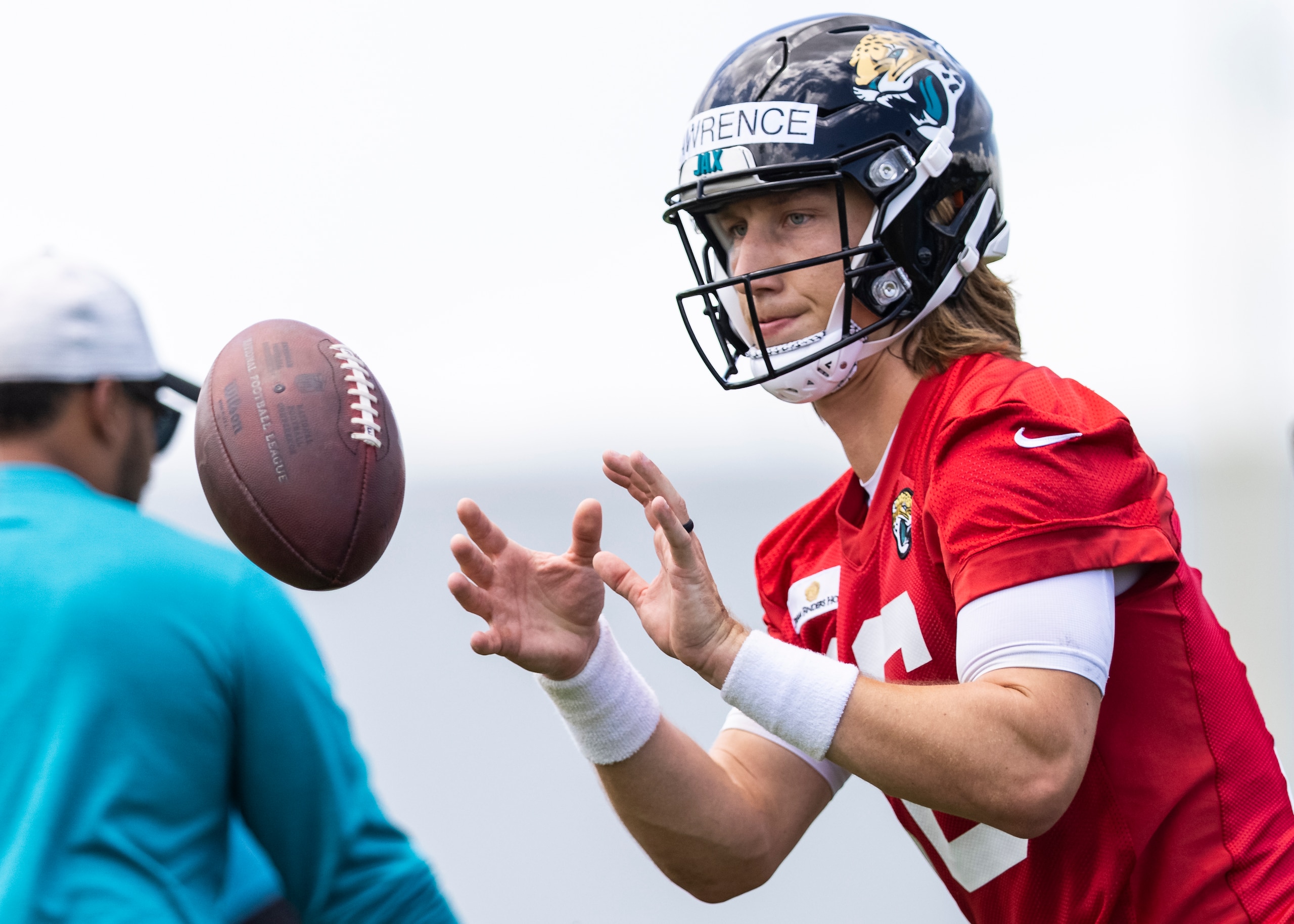 JACKSONVILLE, FLORIDA - JUNE 08: Trevor Lawrence #16 of the Jacksonville Jaguars looks on during Jacksonville Jaguars Training Camp at TIAA Bank Field on June 08, 2021 in Jacksonville, Florida. (Photo by James Gilbert/Getty Images)