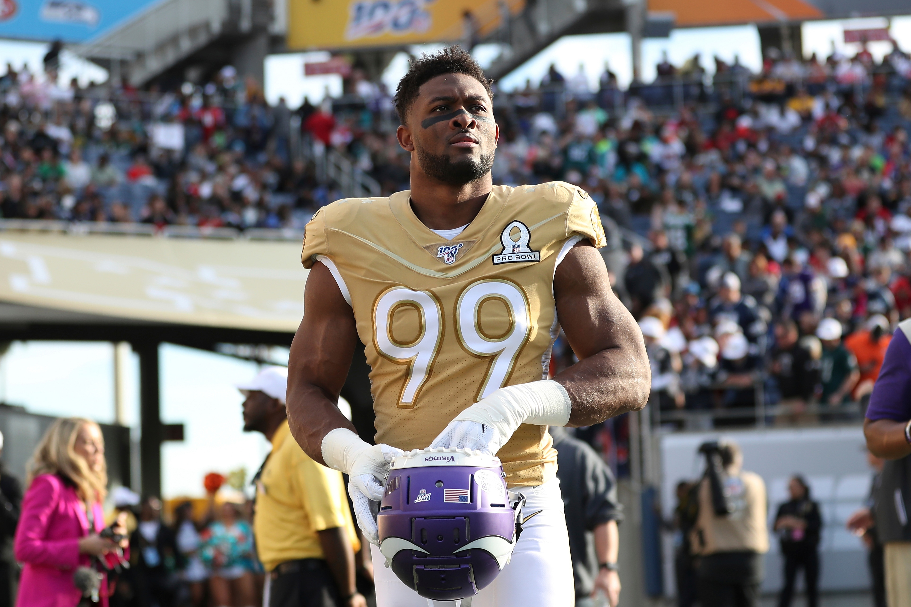 NFC defensive end Danielle Hunter, of the Minnesota Vikings, walks out onto the field before the second half of the NFL Pro Bowl football game against the AFC, Sunday, Jan. 26, 2020, in Orlando, Fla. (AP Photo/Steve Luciano)