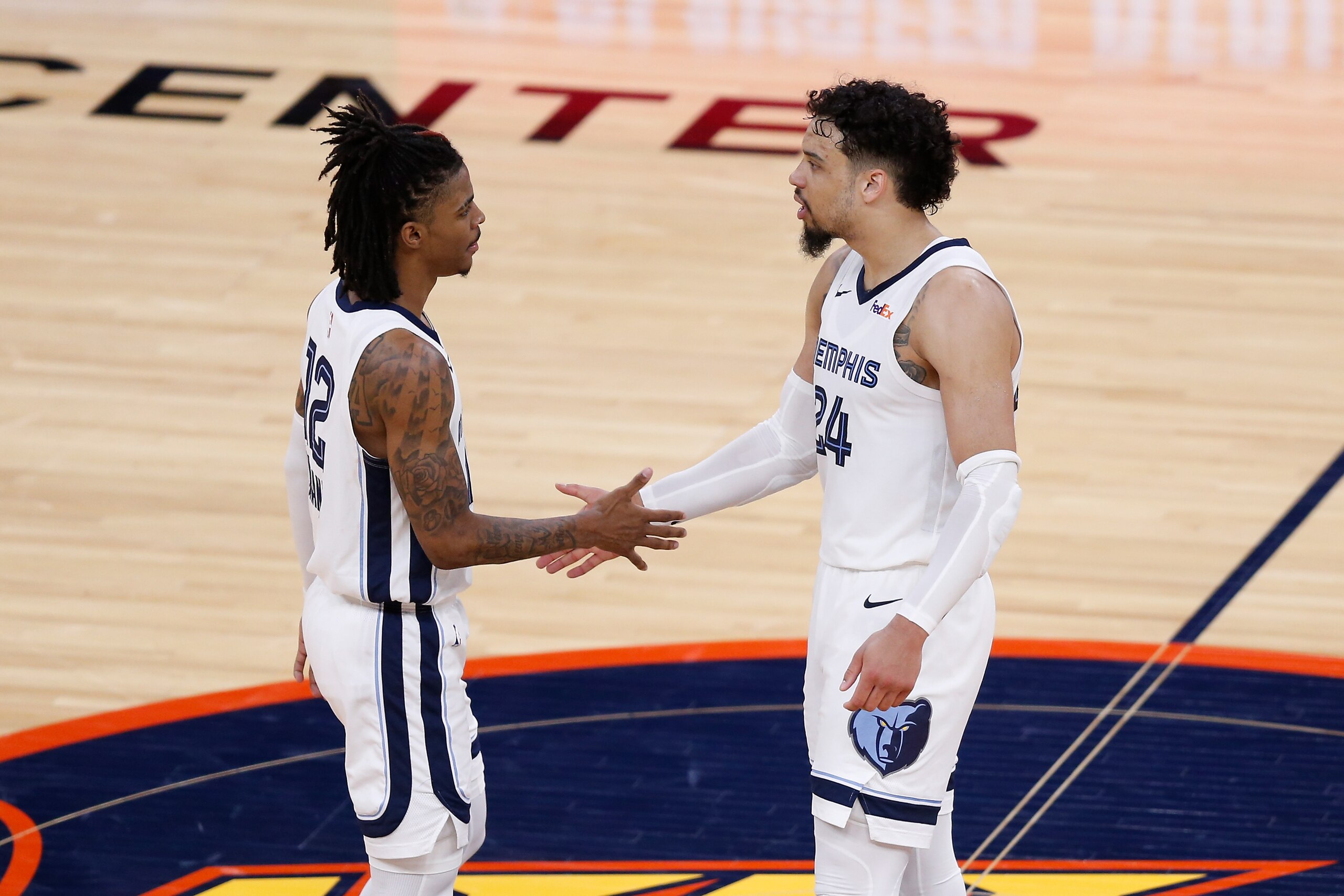 SAN FRANCISCO, CALIFORNIA - MAY 21: Ja Morant #12 and Dillon Brooks #24 of the Memphis Grizzlies celebrate after a win in overtime of the NBA Play-In Tournament game against the Golden State Warriors at Chase Center on May 21, 2021 in San Francisco, California. NOTE TO USER: User expressly acknowledges and agrees that, by downloading and or using this photograph, User is consenting to the terms and conditions of the Getty Images License Agreement. (Photo by Lachlan Cunningham/Getty Images)