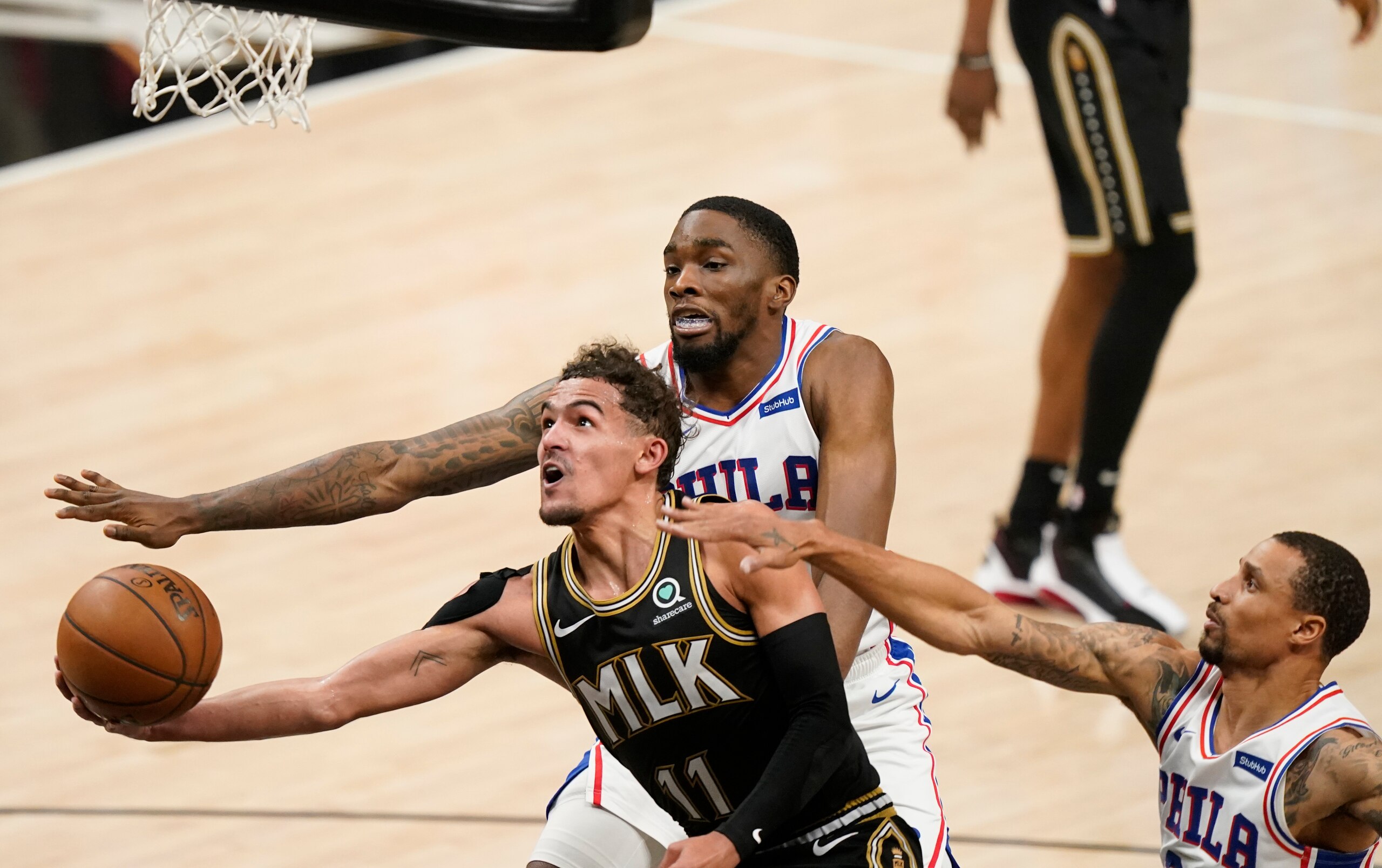 Atlanta Hawks' Trae Young (11) looks to shoot against Philadelphia 76ers' Shake Milton (18) during the second half of Game 4 of a second-round NBA basketball playoff series against the Philadelphia 76ers on Monday, June 14, 2021, in Atlanta. (AP Photo/Brynn Anderson) Atlanta Hawks' Trae Young (11) looks to shoot against Philadelphia 76ers' Shake Milton (18) during the second half of Game 4 of a second-round NBA basketball playoff series against the Philadelphia 76ers on Monday, June 14, 2021, in Atlanta. (AP Photo/Brynn Anderson)