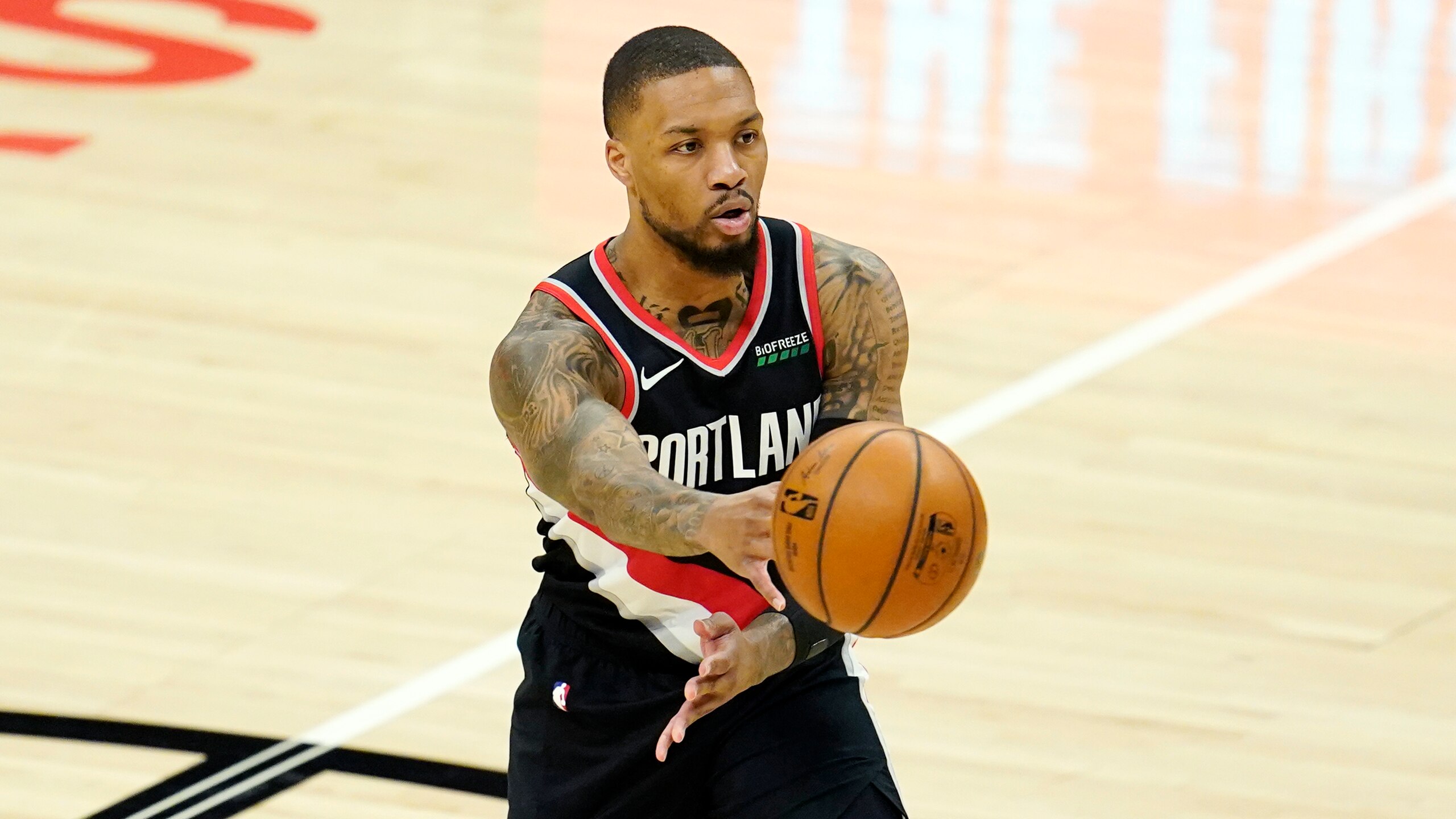 Portland Trail Blazers guard Damian Lillard passes during an NBA basketball game against the Los Angeles Clippers Tuesday, April 6, 2021, in Los Angeles. (AP Photo/Marcio Jose Sanchez)