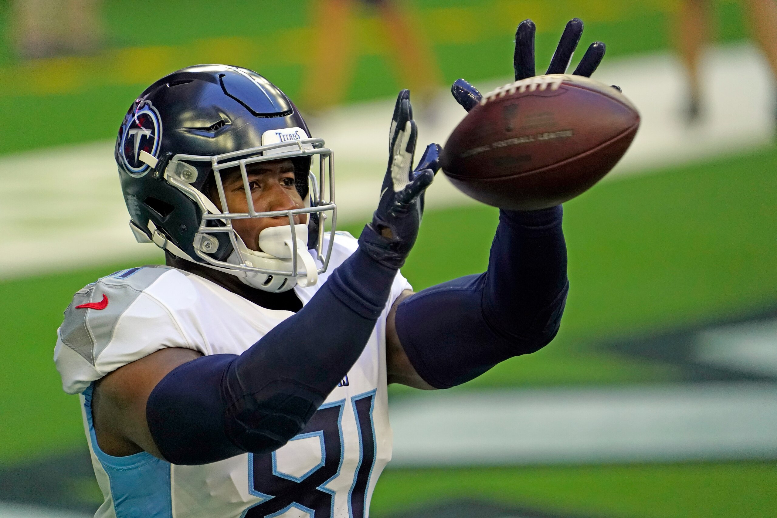Tennessee Titans tight end Jonnu Smith catches a pass before an NFL football game against the Houston Texans Sunday, Jan. 3, 2021, in Houston. (AP Photo/Sam Craft)