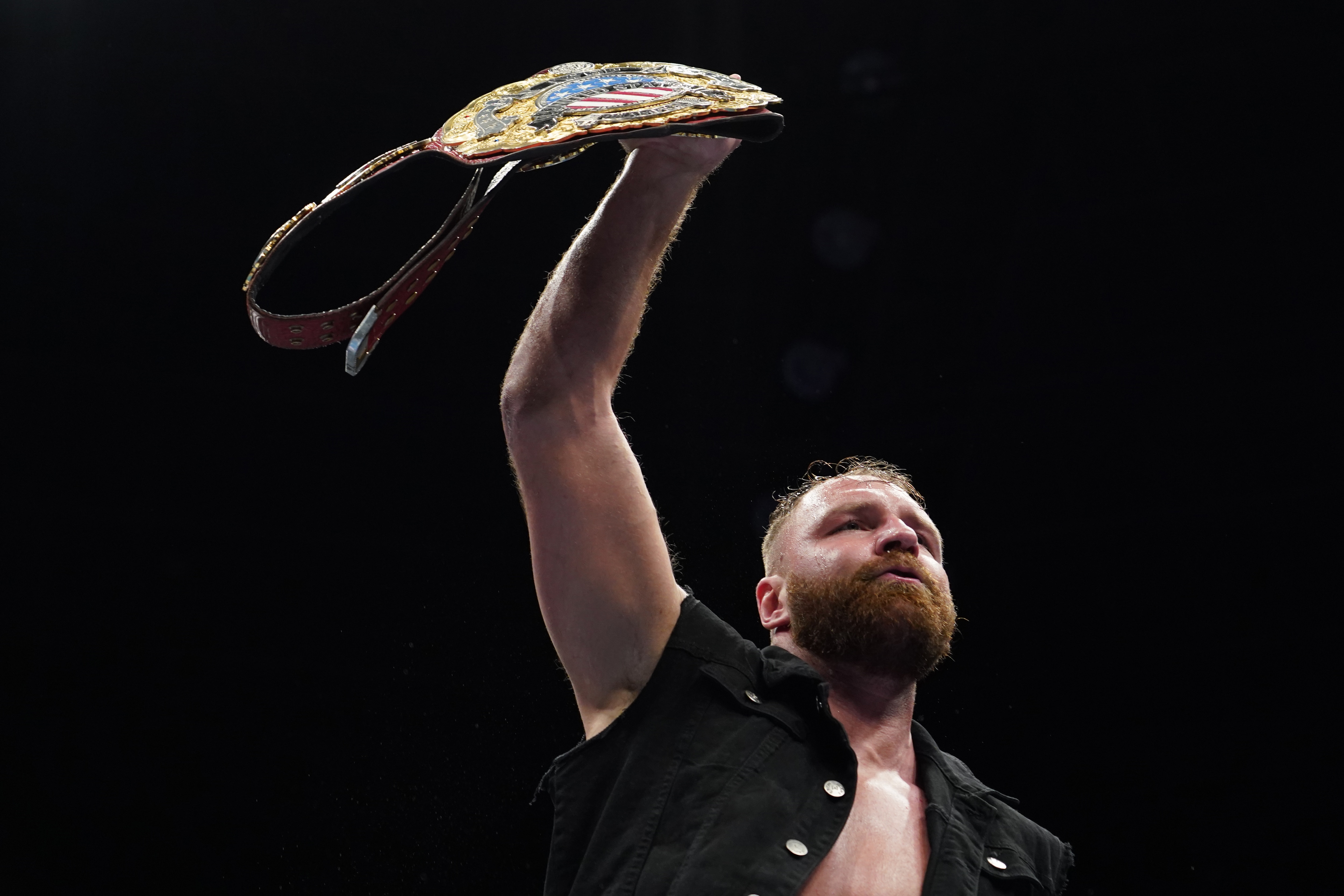 TOKYO, JAPAN - JANUARY 06: Jon Moxley lifts the belt during the New Japan Pro-Wrestling 'New Year Dash' at the Oita City General Gymnasium on January 06, 2020 in Tokyo, Japan. (Photo by Etsuo Hara/Getty Images)