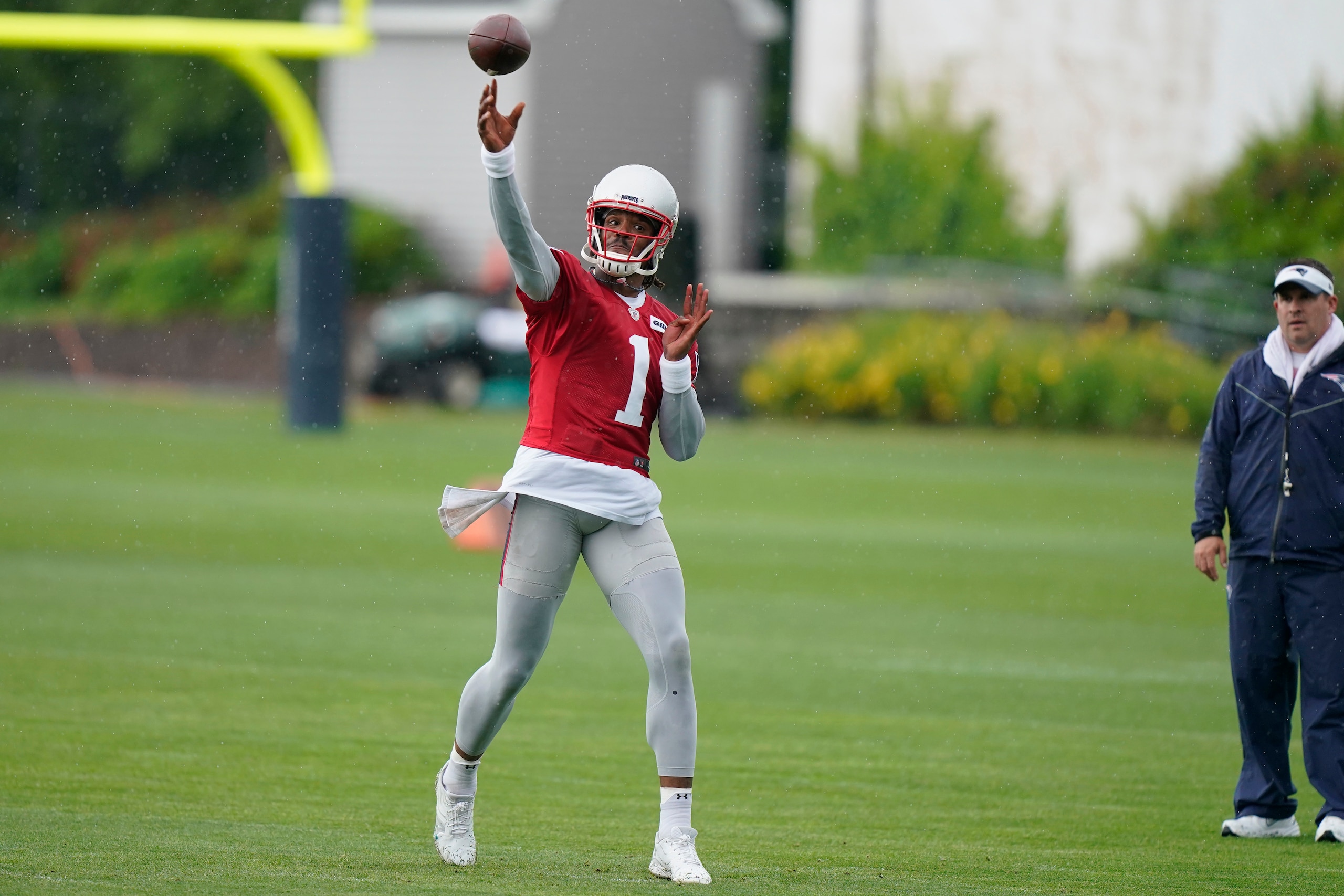 New England Patriots quarterback Cam Newton (1) passes the ball during an NFL football practice, Monday, June 14, 2021, in Foxborough, Mass. (AP Photo/Steven Senne) New England Patriots quarterback Cam Newton (1) passes the ball during an NFL football practice, Monday, June 14, 2021, in Foxborough, Mass. (AP Photo/Steven Senne)