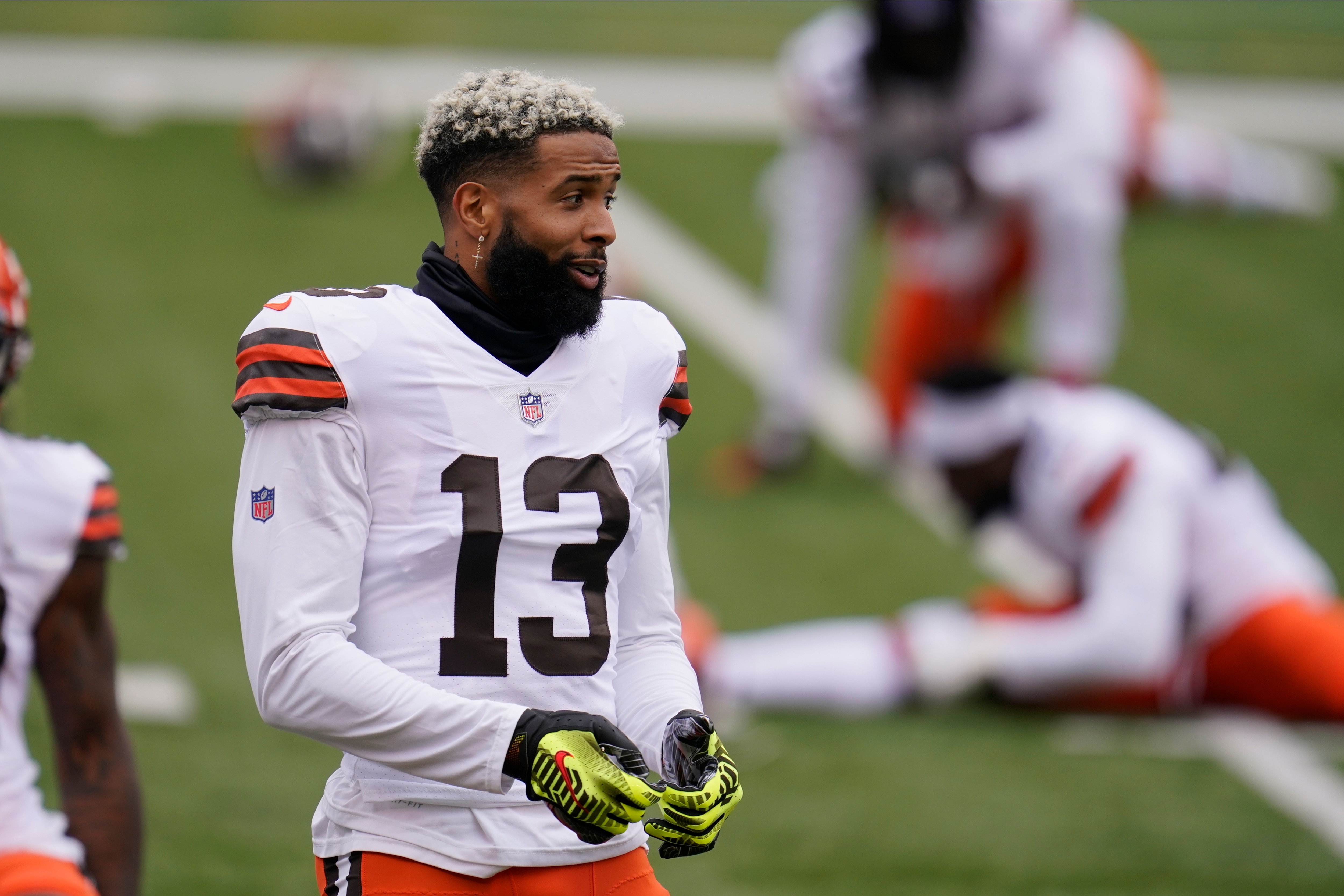 Cleveland Browns' Odell Beckham Jr. (13) stretches before an NFL football game against the Cincinnati Bengals, Sunday, Oct. 25, 2020, in Cincinnati. (AP Photo/Michael Conroy)