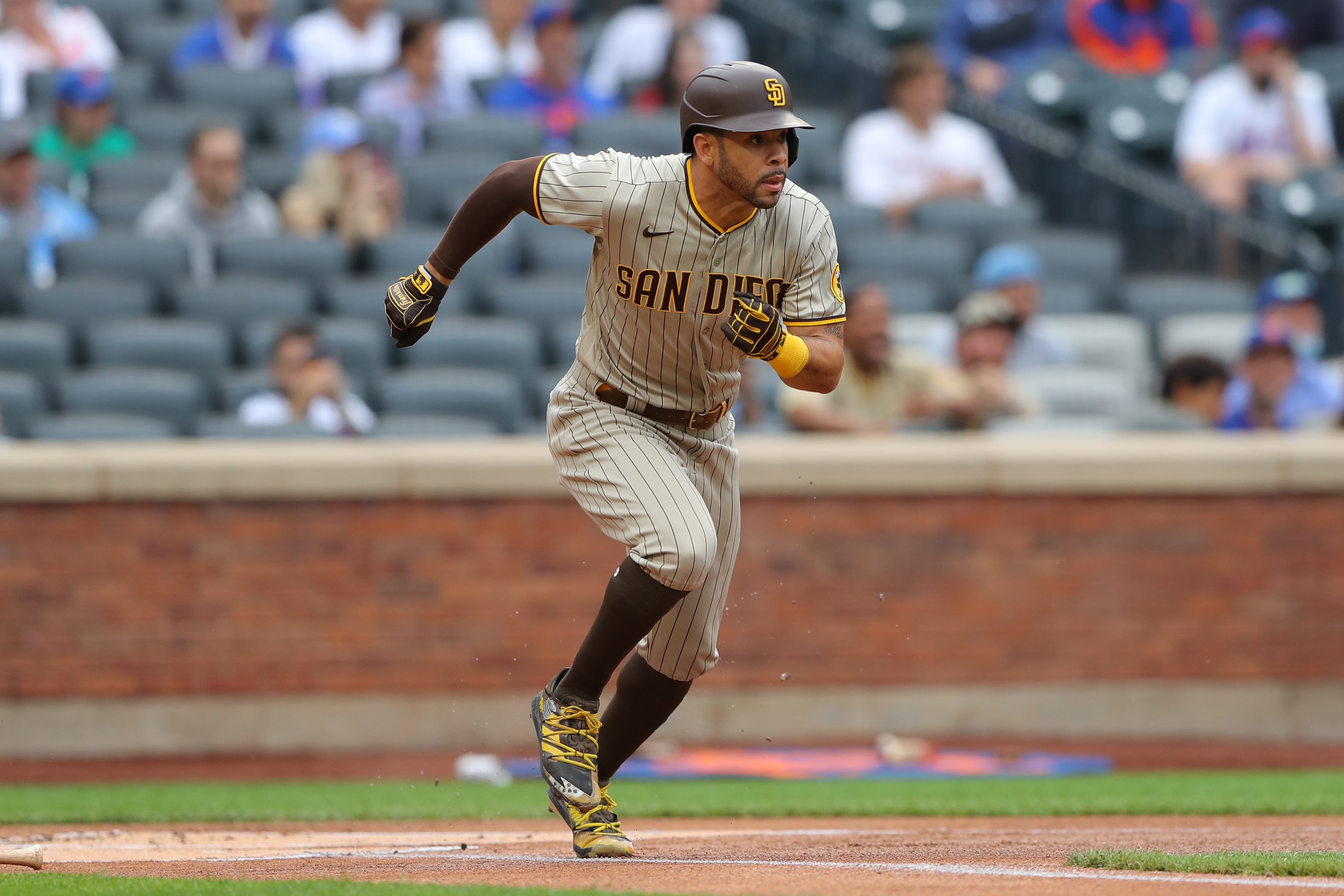 FLUSHING, NY - JUNE 12:  Tommy Pham #28 of the San Diego Padres runs to first during the game between the San Diego Padres and the New York Mets at Citi Field on Saturday, June 12, 2021 in Flushing, New York. (Photo by Mary DeCicco/MLB Photos via Getty Images)