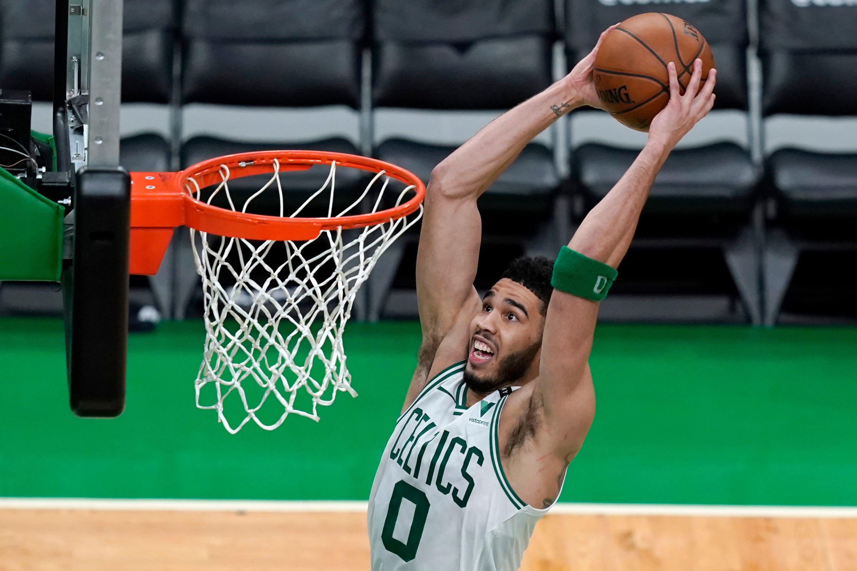 Boston Celtics forward Jayson Tatum (0) dunks against the Brooklyn Nets in the second half of Game 4 during an NBA basketball first-round playoff series, Sunday, May 30, 2021, in Boston. (AP Photo/Elise Amendola)