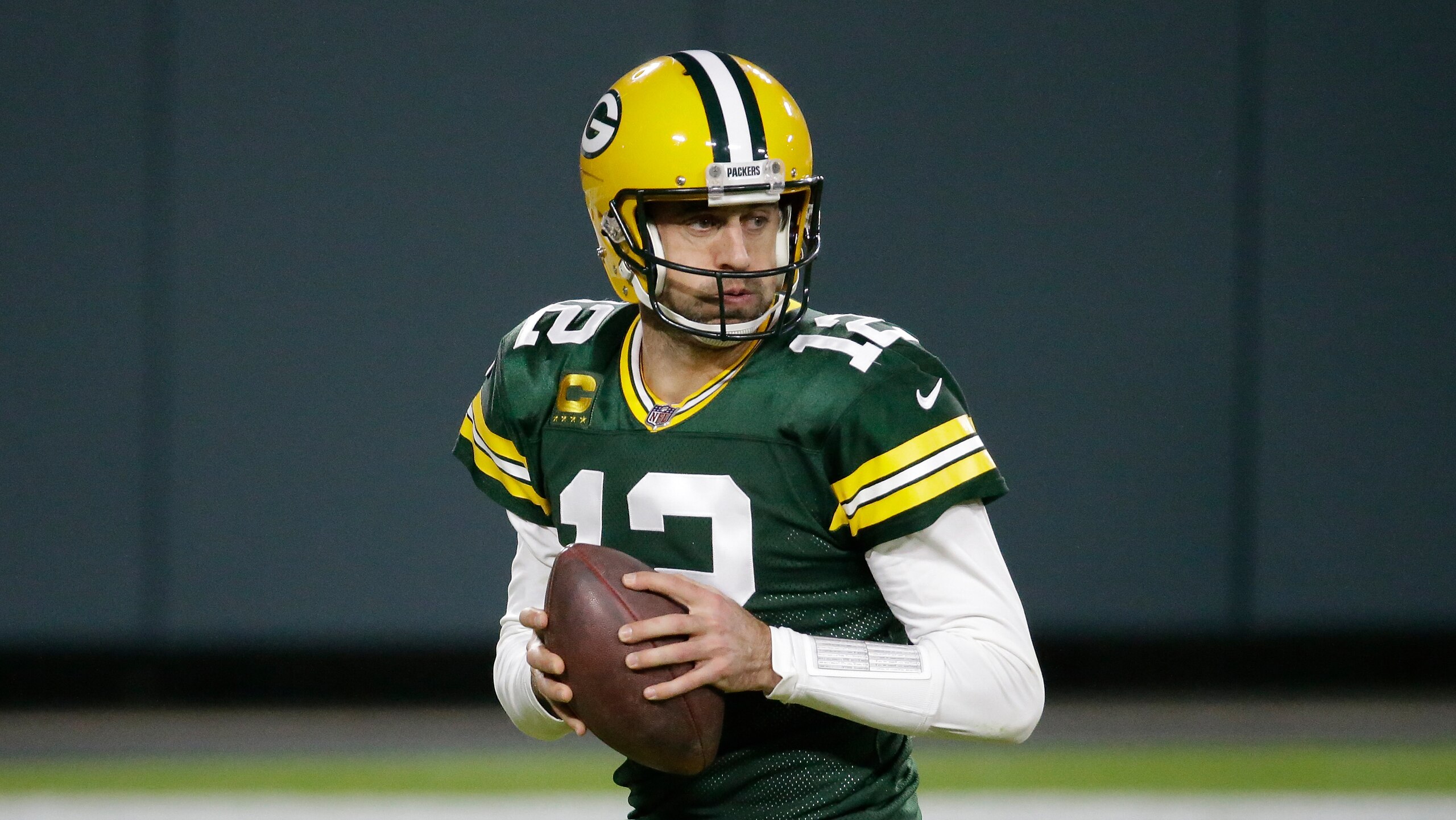 Green Bay Packers' Aaron Rodgers drops back during the second half of an NFL football game against the Philadelphia Eagles Sunday, Dec. 6, 2020, in Green Bay, Wis. (AP Photo/Mike Roemer)