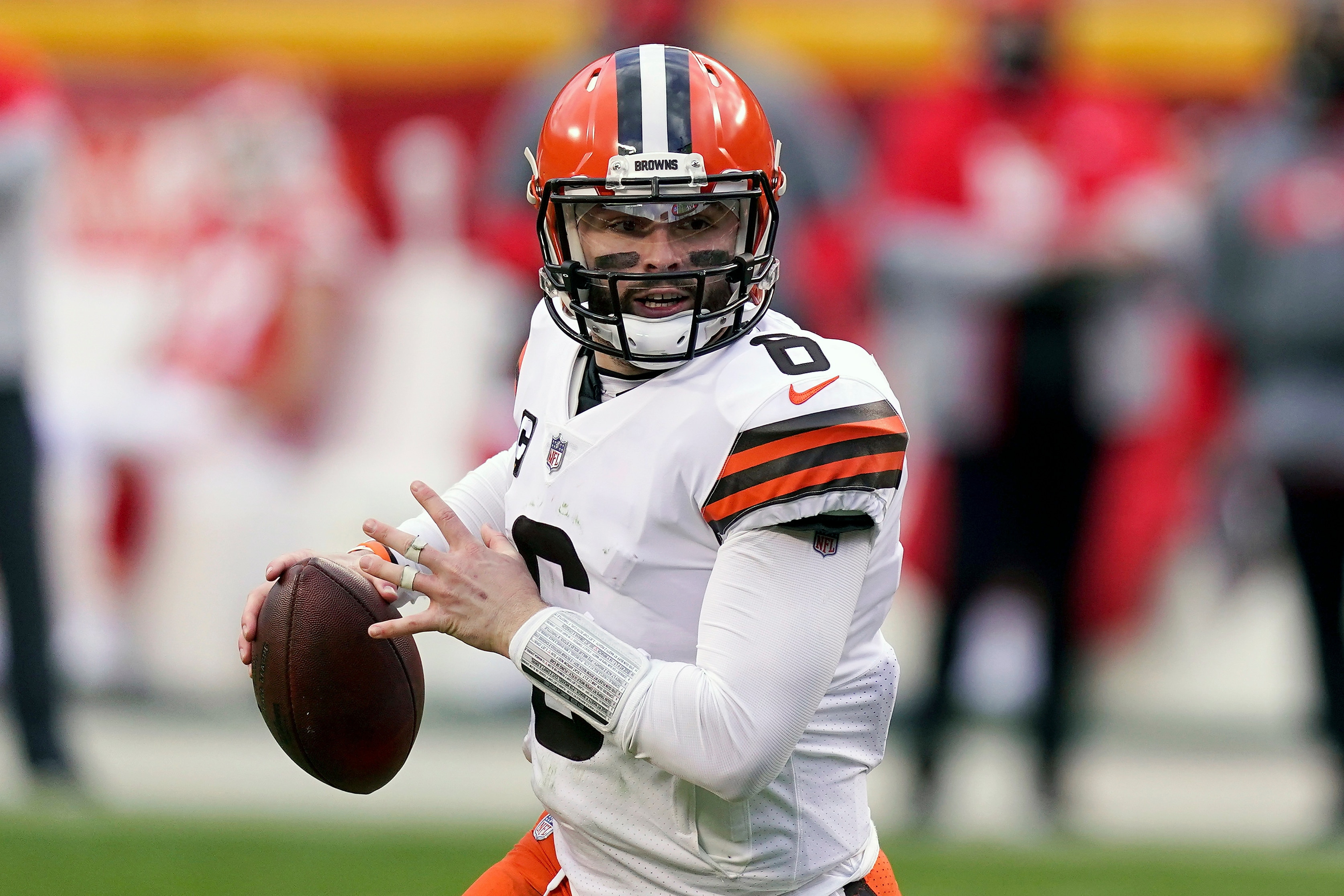 FILE - Cleveland Browns quarterback Baker Mayfield throws during the second half of an NFL divisional round football game against the Kansas City Chiefs in Kansas City, Mo., in this Sunday, Jan. 17, 2021, file photo. The Browns exercised the fifth-year option on quarterback Baker Mayfield's rookie contract, an expected move after his strong 2020 season. (AP Photo/Charlie Riedel, File)