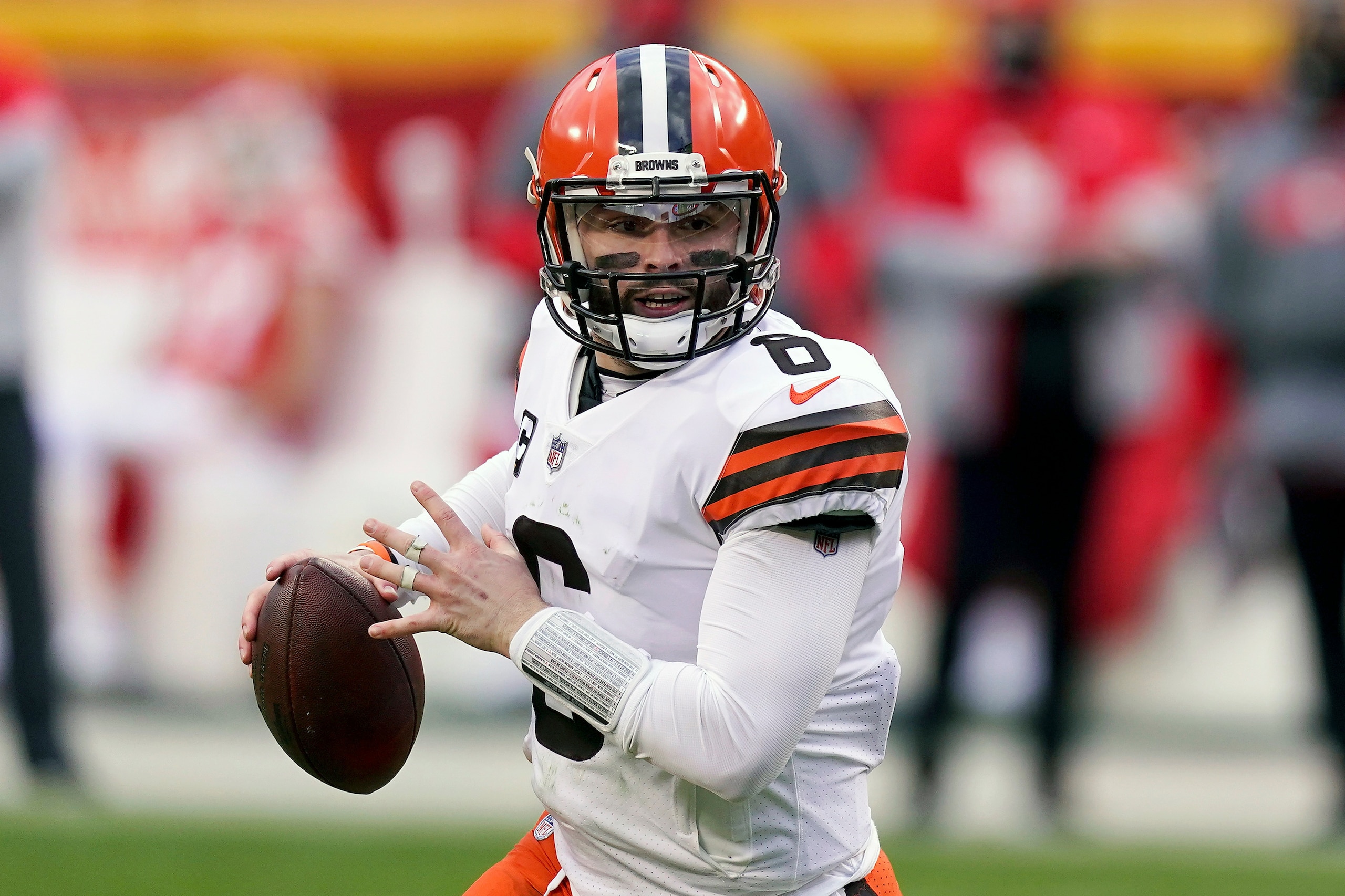 FILE - Cleveland Browns quarterback Baker Mayfield throws during the second half of an NFL divisional round football game against the Kansas City Chiefs in Kansas City, Mo., in this Sunday, Jan. 17, 2021, file photo. The Browns exercised the fifth-year option on quarterback Baker Mayfield's rookie contract, an expected move after his strong 2020 season. (AP Photo/Charlie Riedel, File)