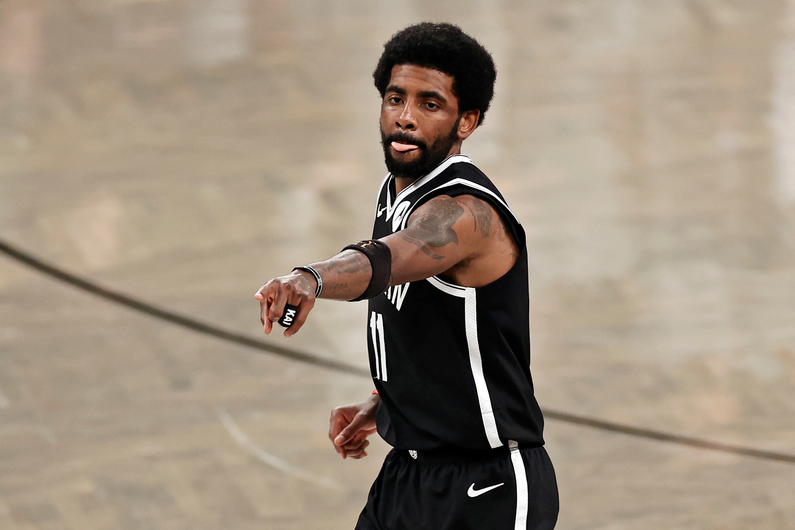 Brooklyn Nets guard Kyrie Irving (11) reacts against the Milwaukee Bucks during the second half of Game 1 of an NBA basketball second-round playoff series Saturday, June 5, 2021, in New York. (AP Photo/Adam Hunger)