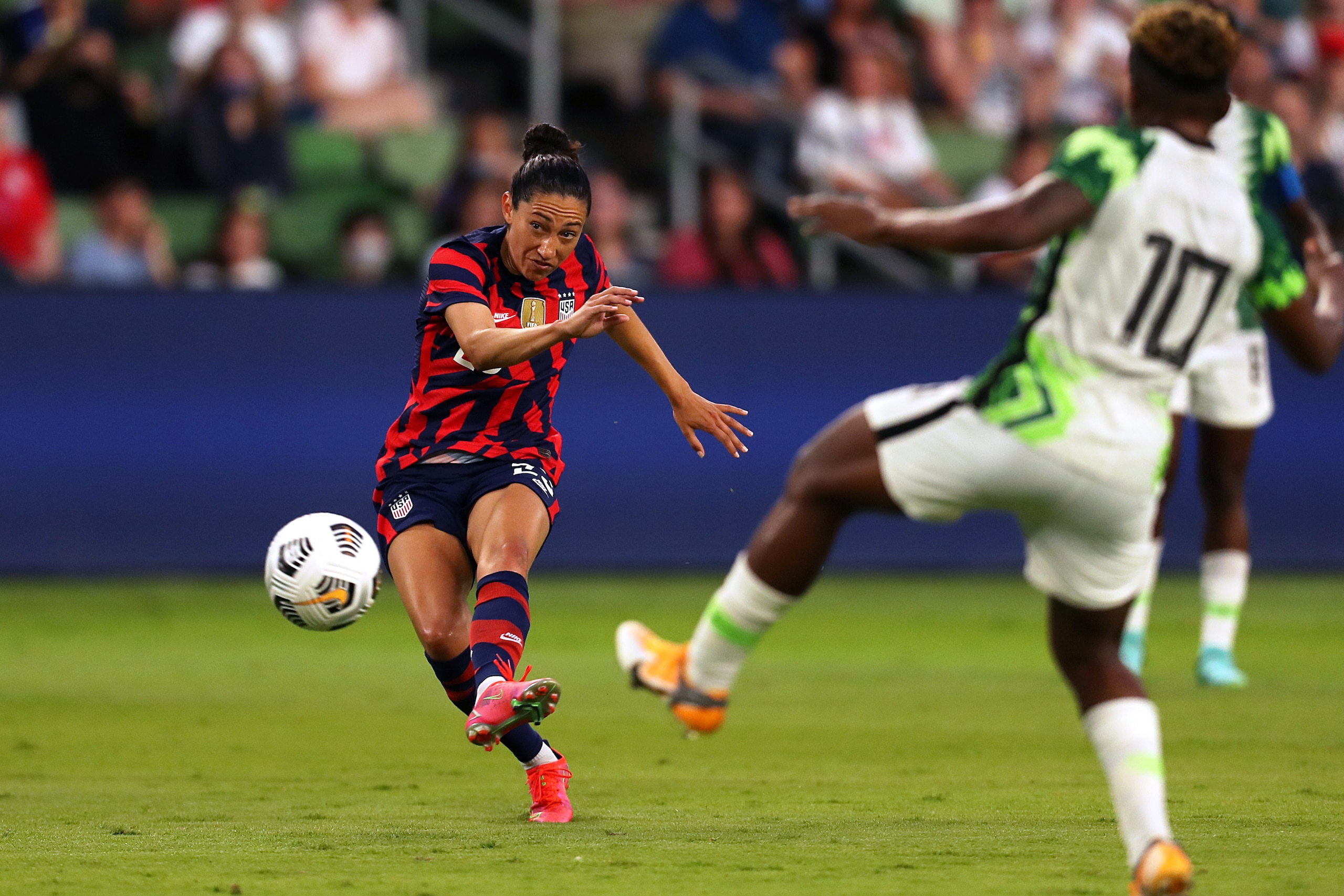AUSTIN, TX - JUNE 16: Christen Press #23 of United States kicks the ball during the Summer Series game between United States and Nigeria at Q2 Stadium on June 16, 2021 in Austin, Texas. (Photo by Omar Vega/Getty Images)