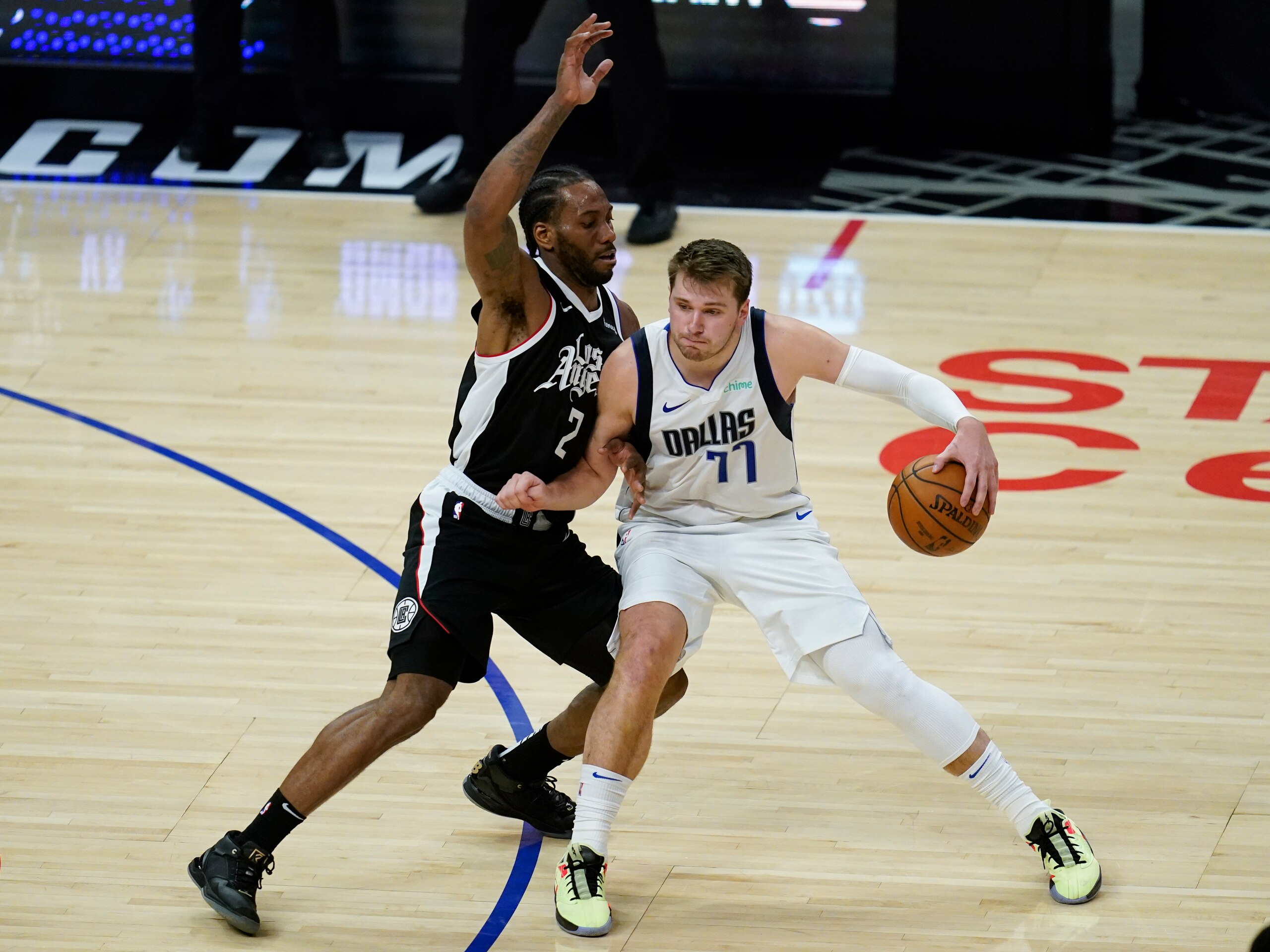 Los Angeles Clippers forward Kawhi Leonard (2) defends against Dallas Mavericks guard Luka Doncic (77) during the second half of Game 7 of an NBA basketball first-round playoff series Sunday, June 6, 2021, in Los Angeles, Calif. (AP Photo/Ashley Landis) Los Angeles Clippers forward Kawhi Leonard (2) defends against Dallas Mavericks guard Luka Doncic (77) during the second half of Game 7 of an NBA basketball first-round playoff series Sunday, June 6, 2021, in Los Angeles, Calif. (AP Photo/Ashley Landis)