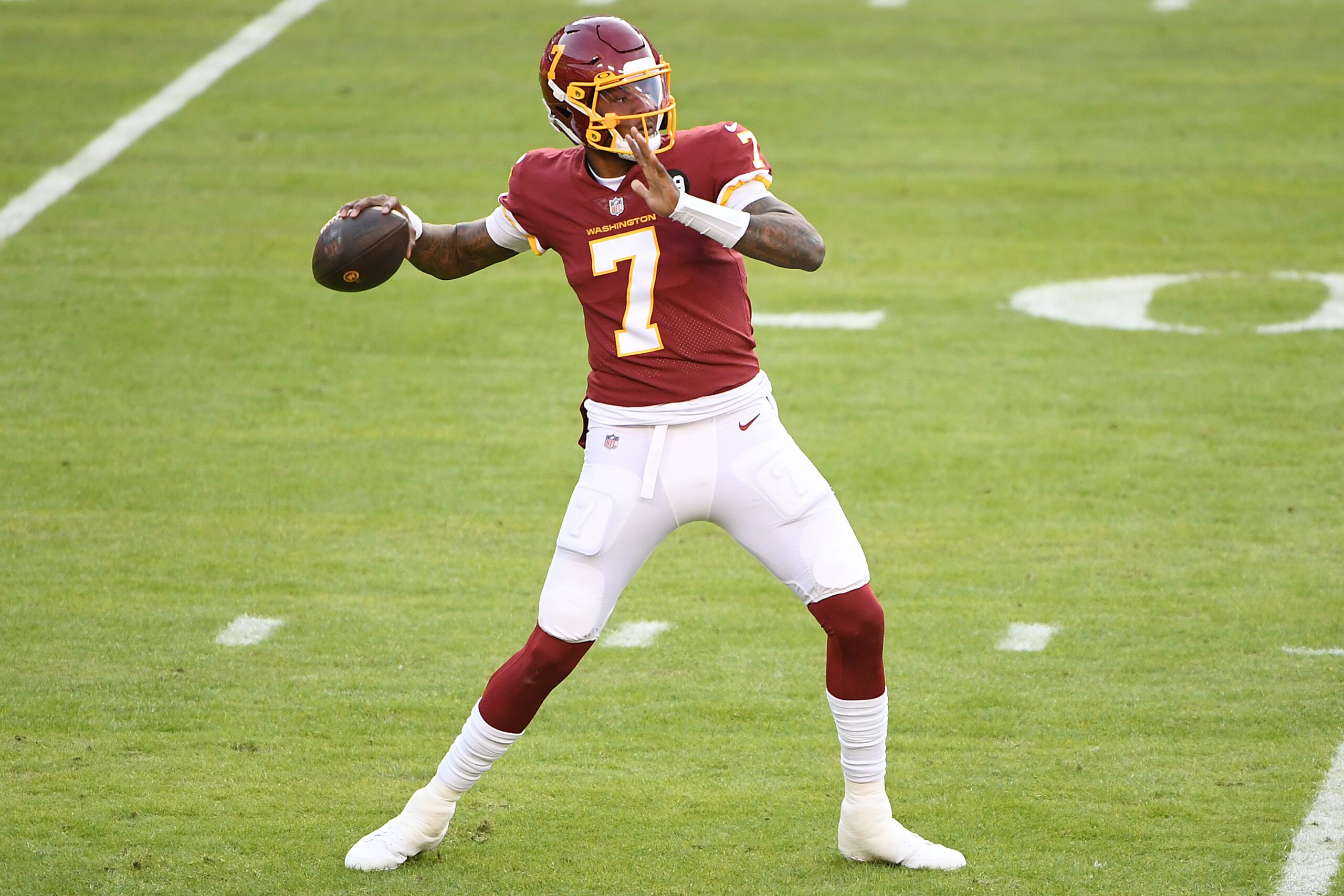 LANDOVER, MARYLAND - DECEMBER 27: Dwayne Haskins #7 of the Washington Football Team throws a pass against the Carolina Panthers during the first quarter at FedExField on December 27, 2020 in Landover, Maryland. (Photo by Will Newton/Getty Images)