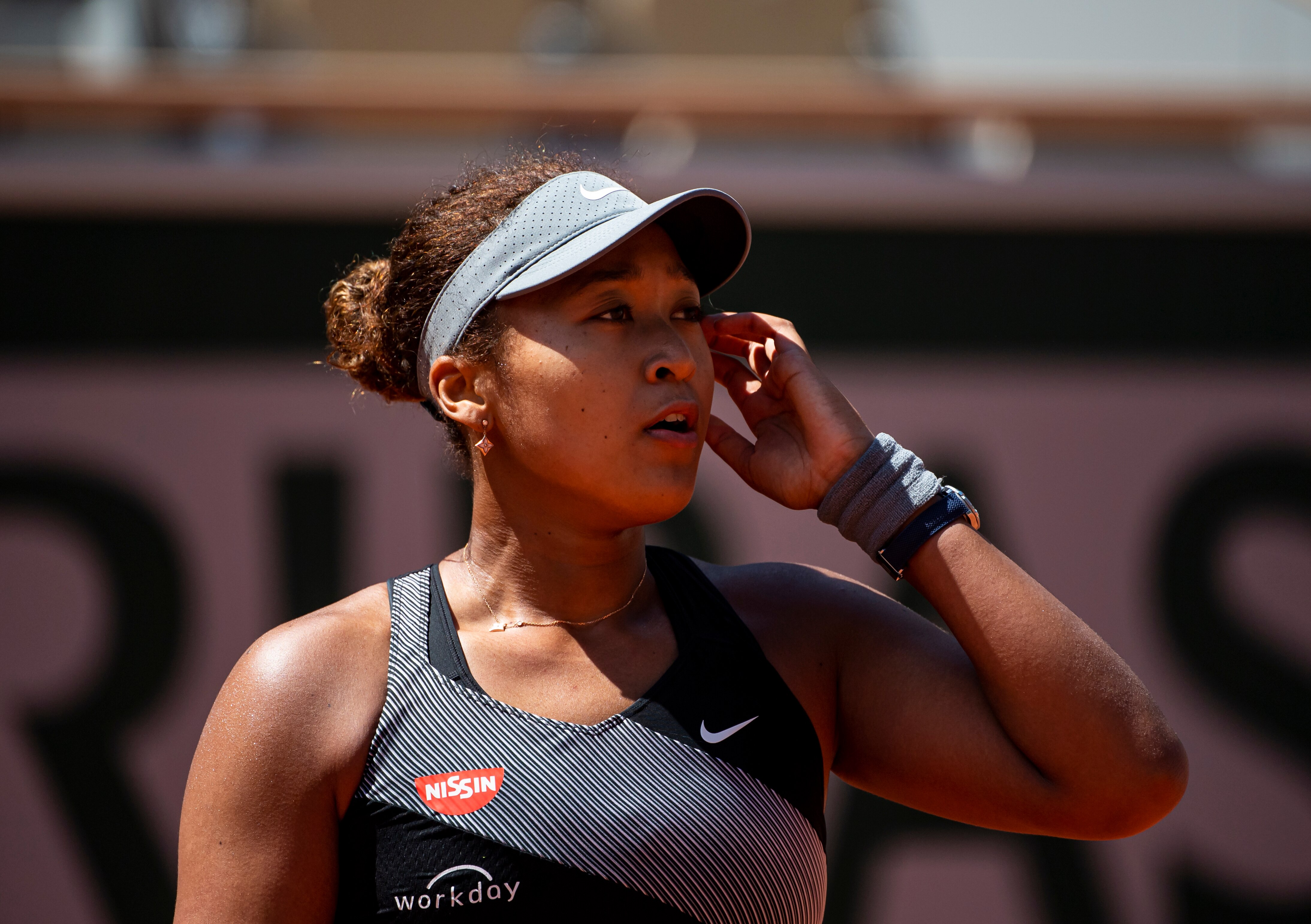 PARIS, FRANCE - MAY 30: Naomi Osaka of Japan looks to her team during her match against Patricia Maria Èig of Romania in the first round of the women’s singles at Roland Garros on May 30, 2021 in Paris, France.