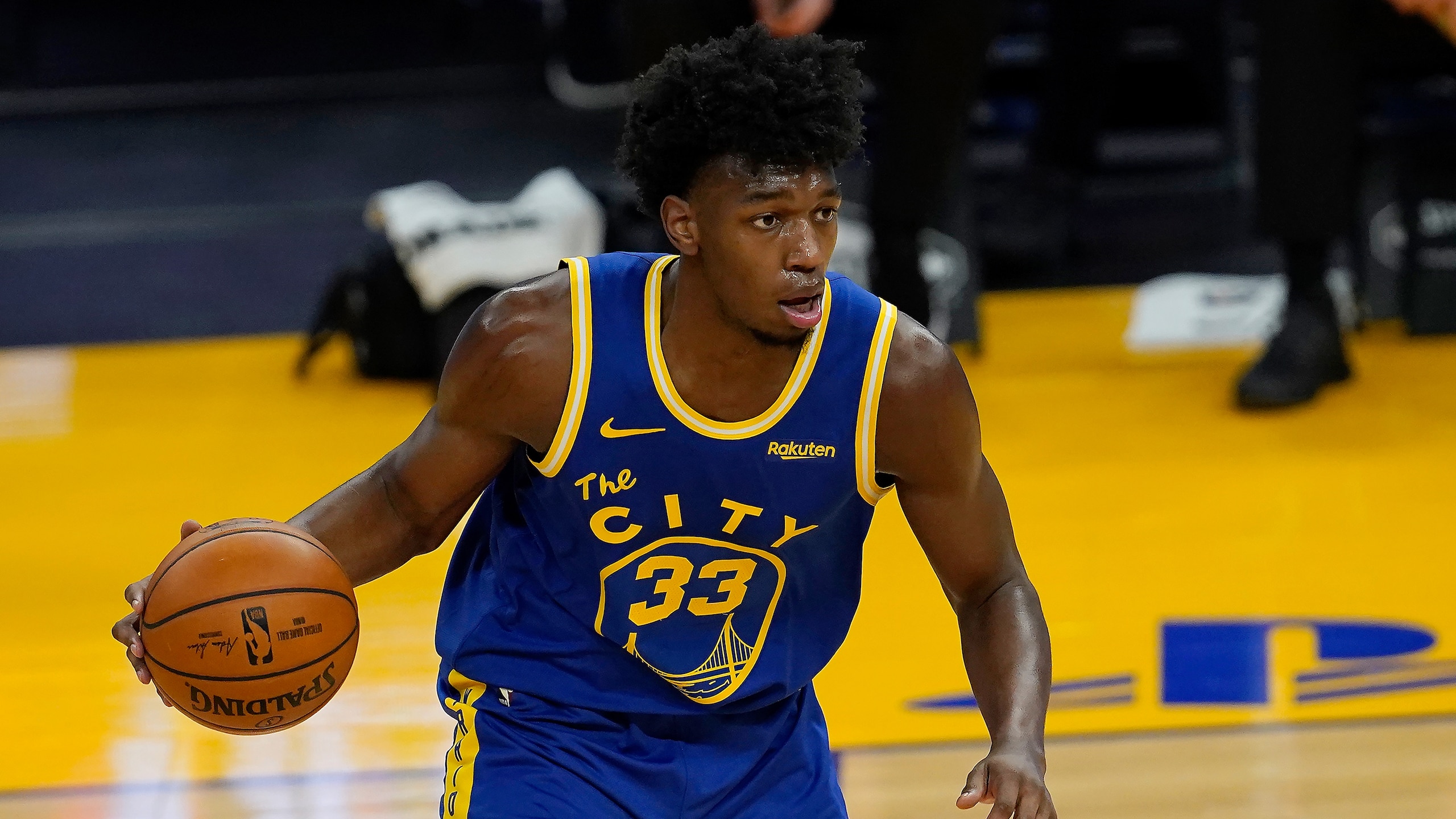 Golden State Warriors center James Wiseman (33) dribbles against the Utah Jazz during the first half of an NBA basketball game in San Francisco, Sunday, March 14, 2021. (AP Photo/Jeff Chiu) Golden State Warriors center James Wiseman (33) dribbles against the Utah Jazz during the first half of an NBA basketball game in San Francisco, Sunday, March 14, 2021. (AP Photo/Jeff Chiu)