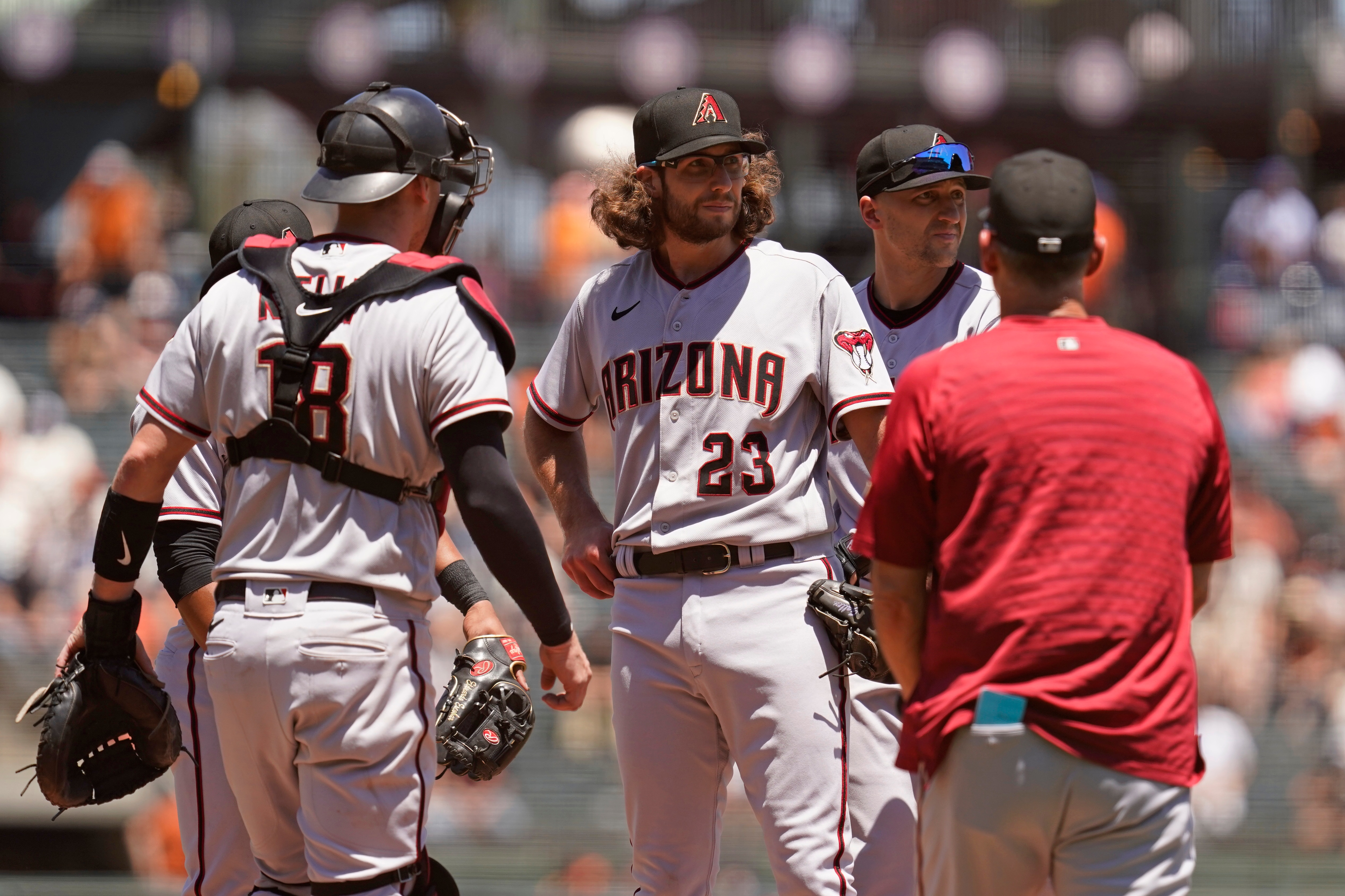 Arizona Diamondbacks starting pitcher Zac Gallen (23) stands on the mound before being removed by manager Torey Lovullo, right, in the third inning of a baseball game against the San Francisco Giants, Thursday, June 17, 2021, in San Francisco. Diamondbacks catcher Carson Kelly, left, and shortstop Nick Ahmed, second from right, look on. (AP Photo/Eric Risberg) Arizona Diamondbacks starting pitcher Zac Gallen (23) stands on the mound before being removed by manager Torey Lovullo, right, in the third inning of a baseball game against the San Francisco Giants, Thursday, June 17, 2021, in San Francisco. Diamondbacks catcher Carson Kelly, left, and shortstop Nick Ahmed, second from right, look on. (AP Photo/Eric Risberg)