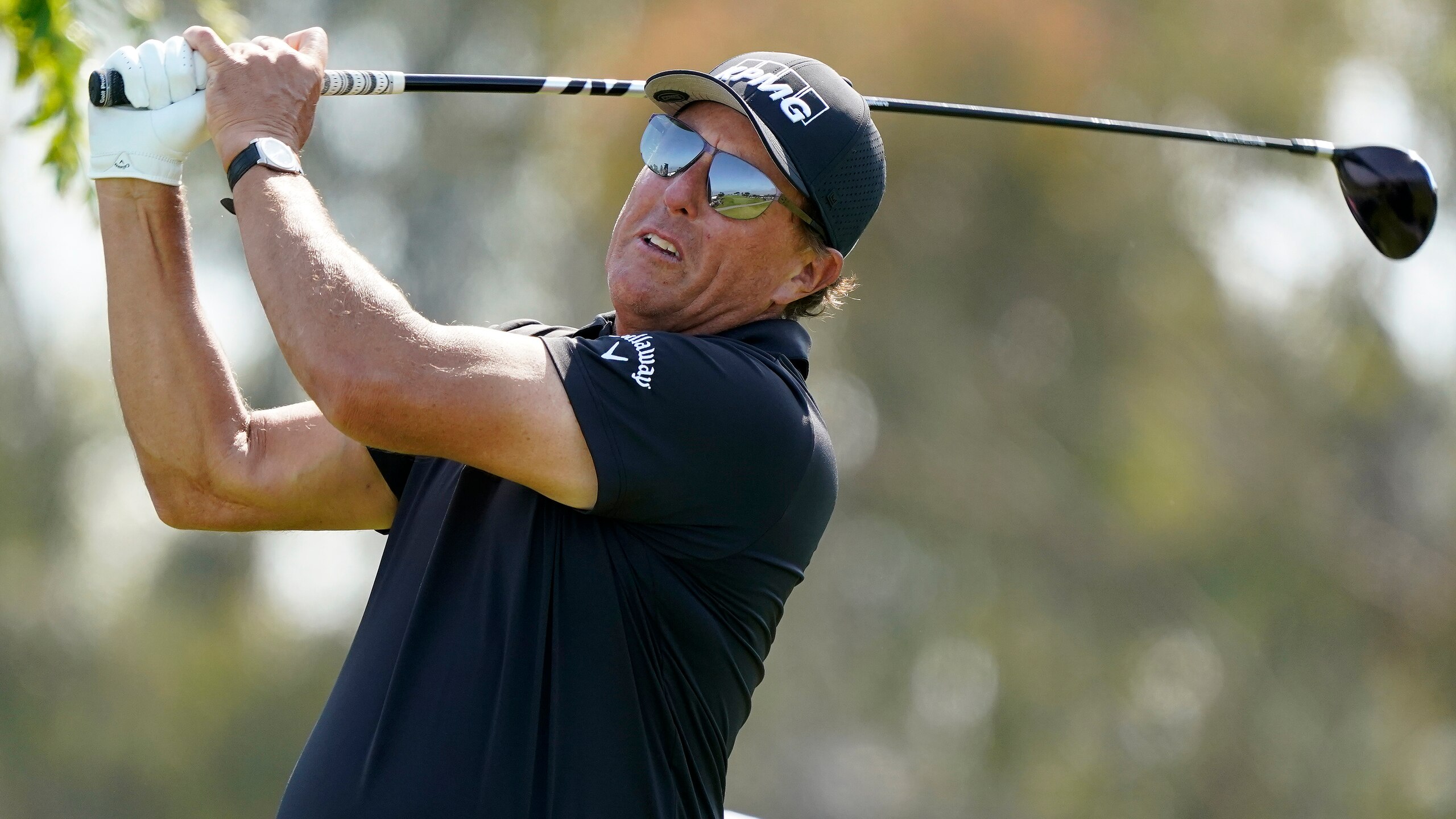 Phil Mickelson plays his shot from the 12th tee during the first round of the U.S. Open Golf Championship, Thursday, June 17, 2021, at Torrey Pines Golf Course in San Diego. (AP Photo/Marcio Jose Sanchez)