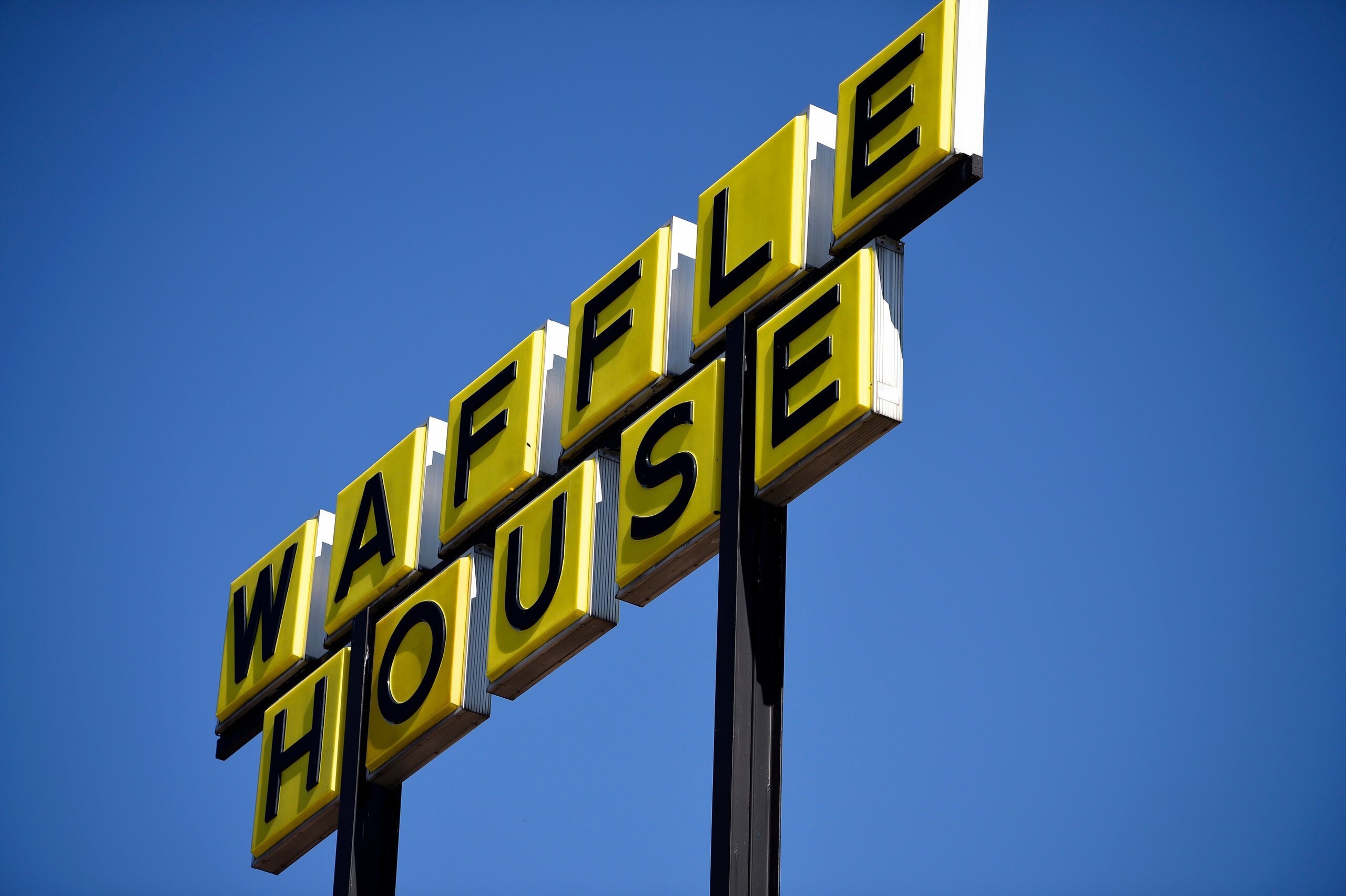 Signage is posted on the inside windown of a Waffle House restaurant, near Kennesaw State, Wednesday, March 25, 2020, in Kennesaw, Ga. (AP Photo/Mike Stewart) Signage is posted on the inside windown of a Waffle House restaurant, near Kennesaw State, Wednesday, March 25, 2020, in Kennesaw, Ga. (AP Photo/Mike Stewart)