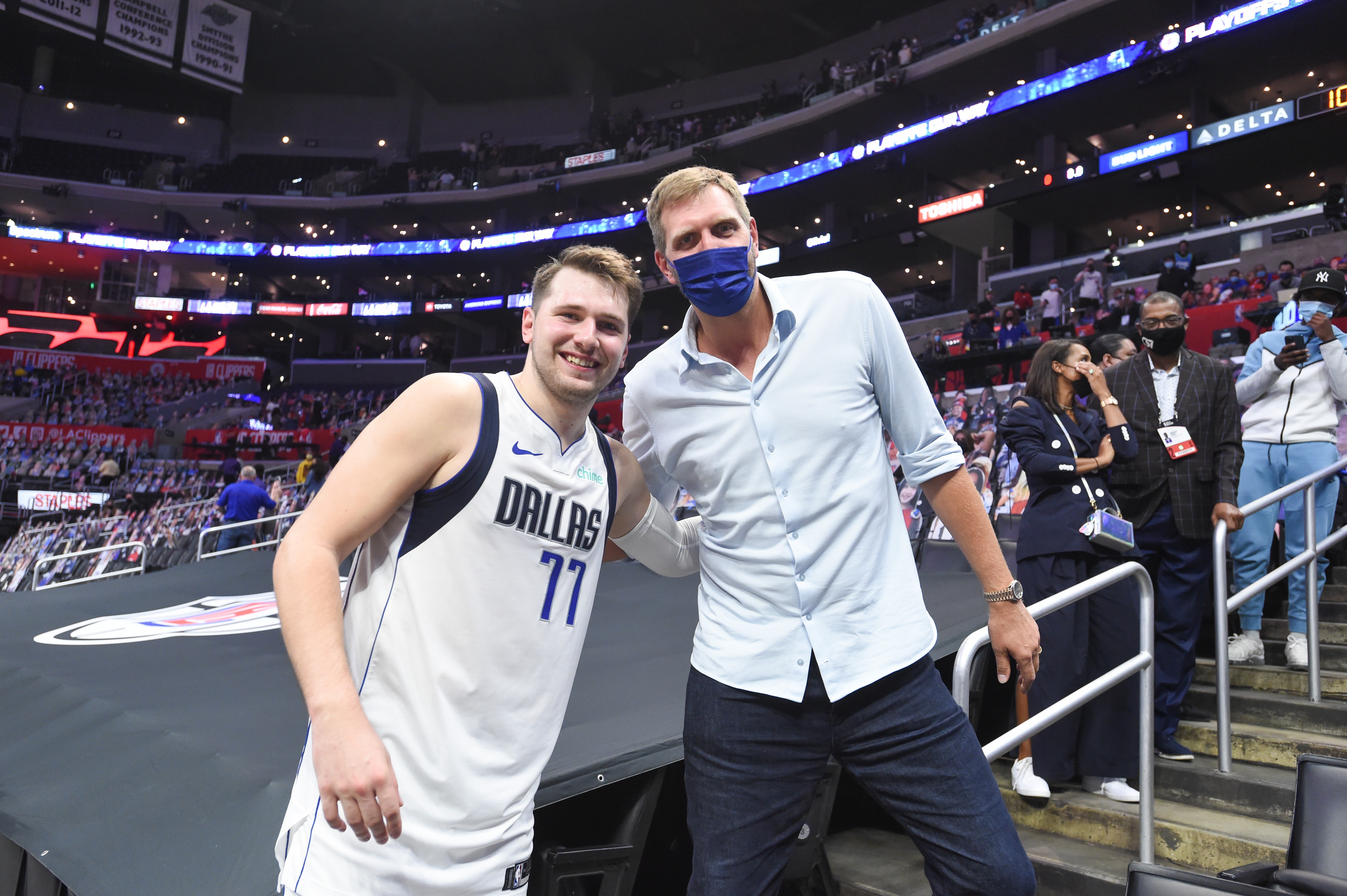 LOS ANGELES, CA - MAY 25: Luka Doncic #77 of the Dallas Mavericks poses with  Dallas Mavericks Legend, Dirk Nowitzki after the game against the LA Clippers during Round 1, Game 2 of the 2021 NBA Playoffs on May 25, 2021 at STAPLES Center in Los Angeles, California. NOTE TO USER: User expressly acknowledges and agrees that, by downloading and/or using this Photograph, user is consenting to the terms and conditions of the Getty Images License Agreement. Mandatory Copyright Notice: Copyright 2021 NBAE (Photo by Juan Ocampo/NBAE via Getty Images)