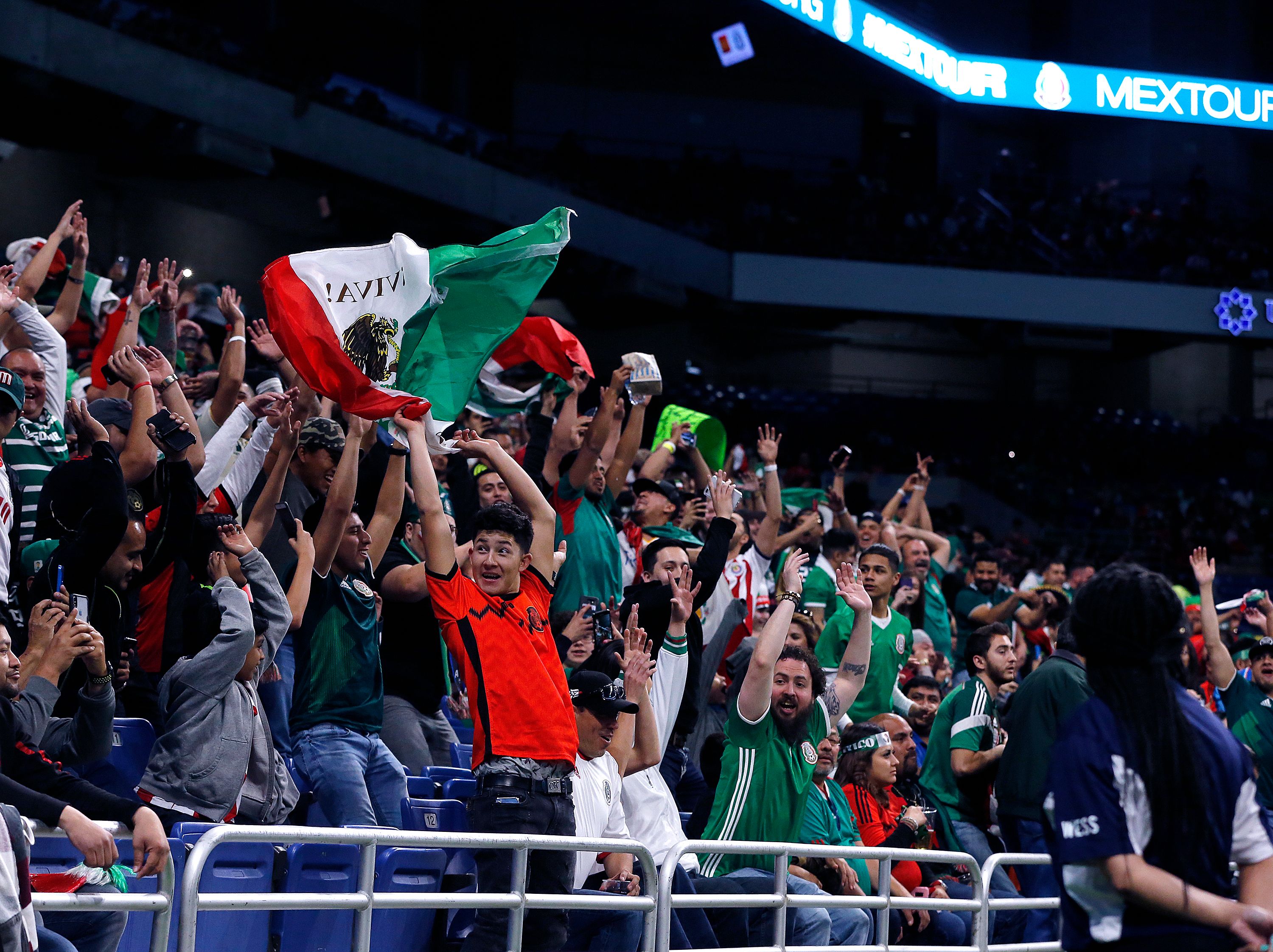 Fans of Mexico's soccer team do the wave during a friendly football game between Mexico and Bosnia and Herzegovina at the Alamodome in San Antonio, Texas, on January 31, 2018. / AFP PHOTO / CHRIS COVATTA        (Photo credit should read CHRIS COVATTA/AFP via Getty Images)