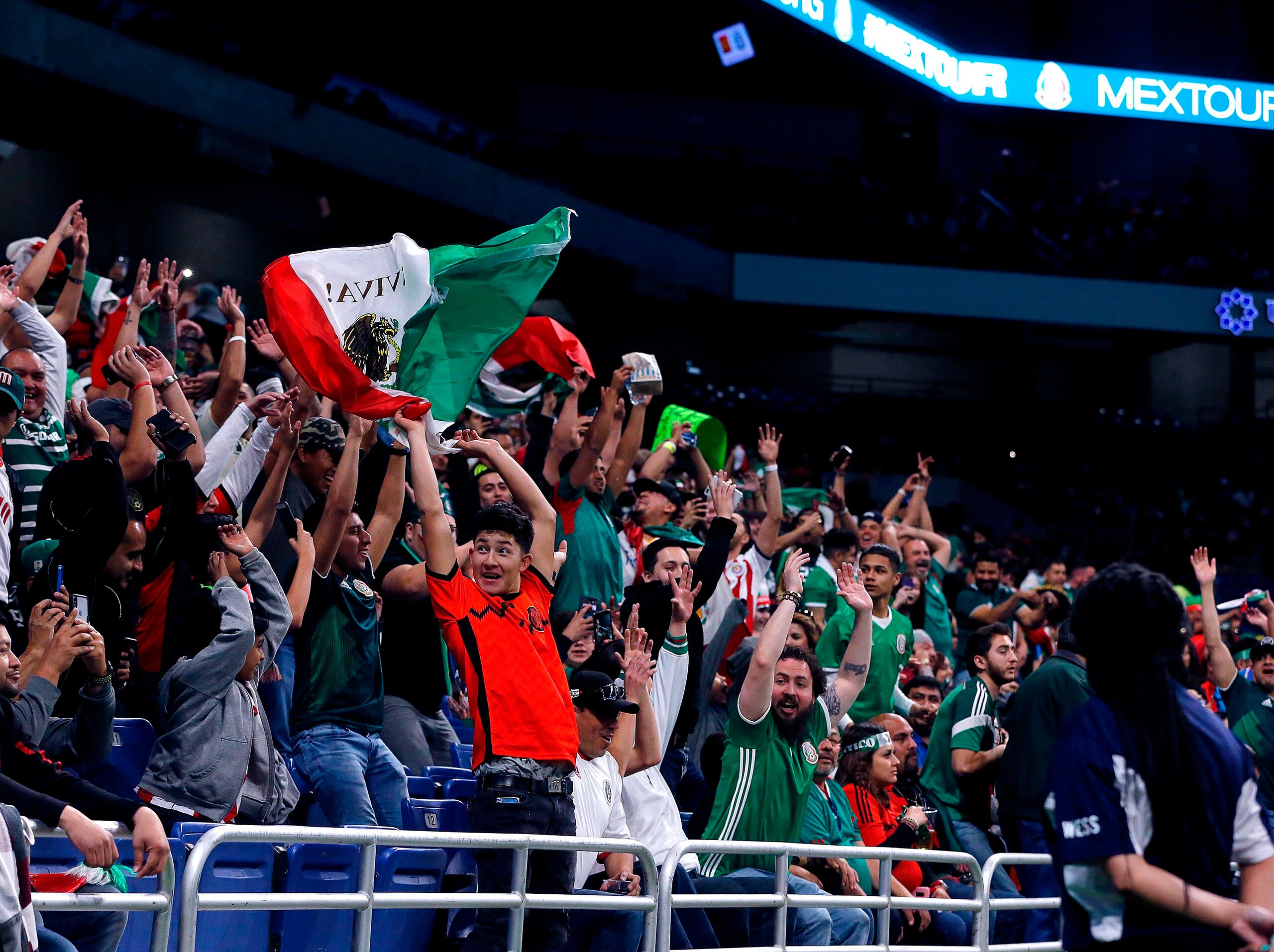 Fans of Mexico's soccer team do the wave during a friendly football game between Mexico and Bosnia and Herzegovina at the Alamodome in San Antonio, Texas, on January 31, 2018. / AFP PHOTO / CHRIS COVATTA        (Photo credit should read CHRIS COVATTA/AFP via Getty Images)