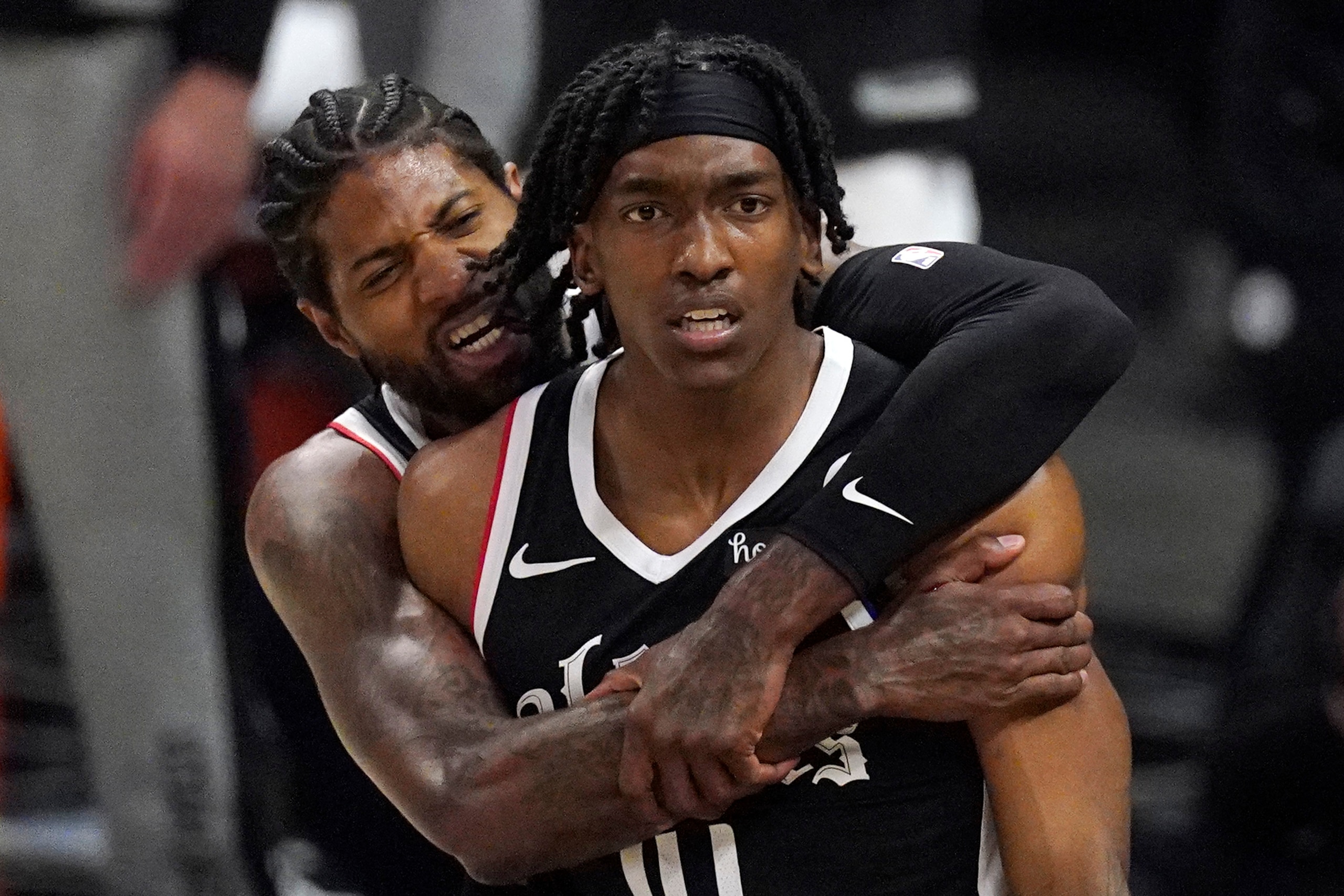Los Angeles Clippers guard Terance Mann, right, celebrates with guard Paul George after scoring and drawing a foul during the first half in Game 6 of a second-round NBA basketball playoff series against the Utah Jazz Friday, June 18, 2021, in Los Angeles. (AP Photo/Mark J. Terrill) Los Angeles Clippers guard Terance Mann, right, celebrates with guard Paul George after scoring and drawing a foul during the first half in Game 6 of a second-round NBA basketball playoff series against the Utah Jazz Friday, June 18, 2021, in Los Angeles. (AP Photo/Mark J. Terrill)