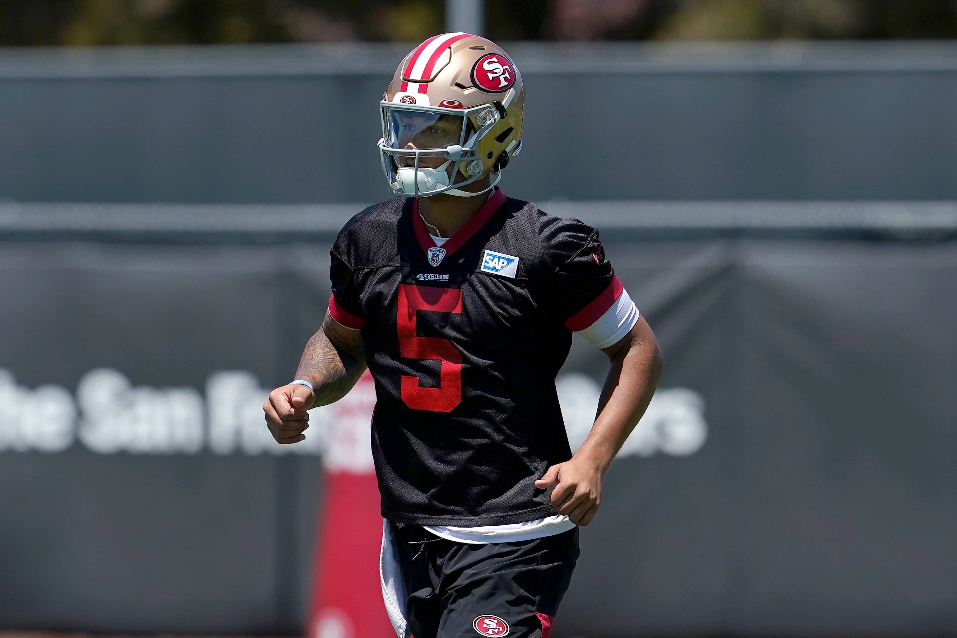 San Francisco 49ers quarterback Trey Lance jogs on the field at the team's NFL football training facility in Santa Clara, Calif., Tuesday, May 25, 2021. (AP Photo/Jeff Chiu)
