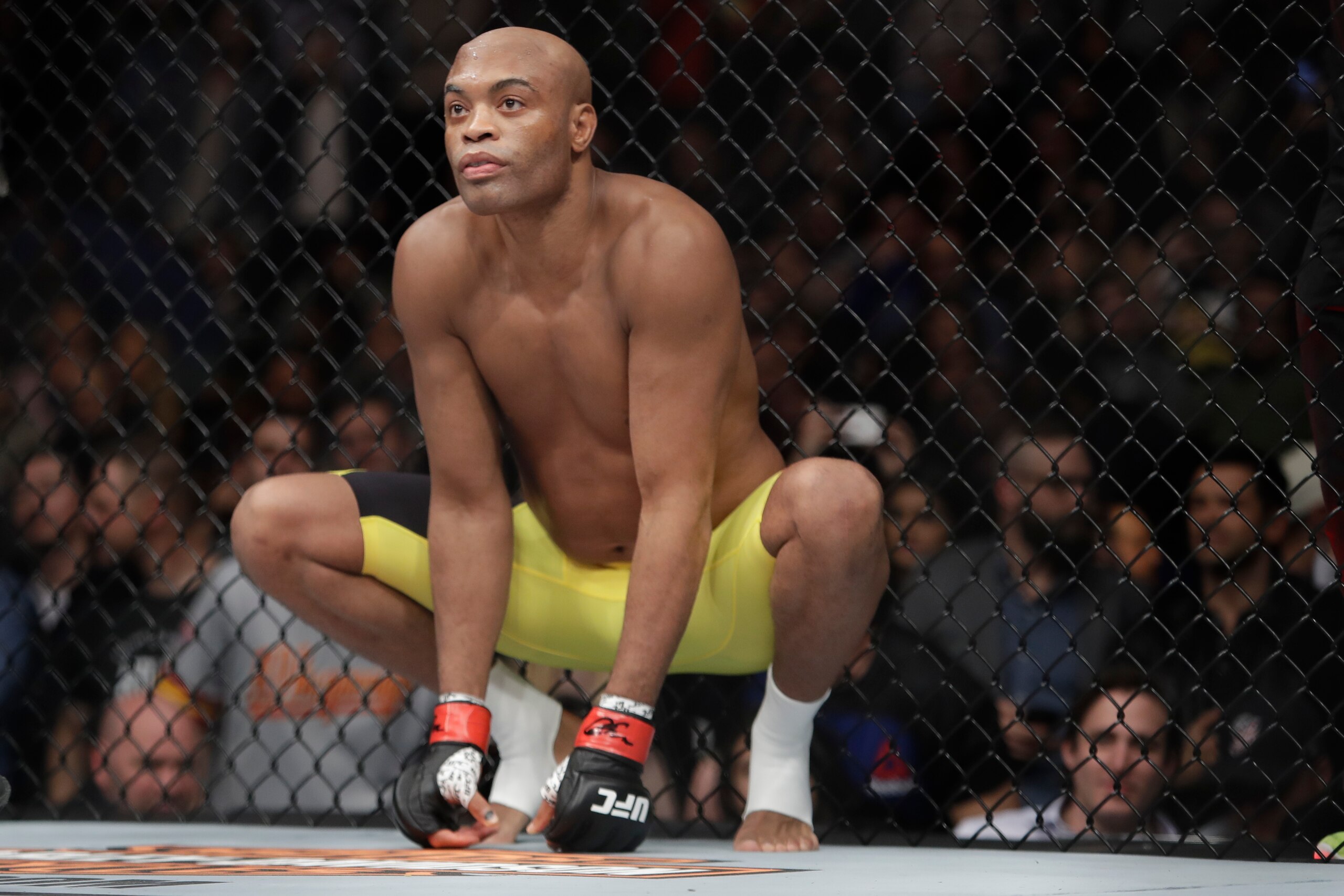 Anderson Silva, of Brazil, squats before a middleweight  mixed martial arts bout against Derek Brunson at UFC 208 Saturday, Feb. 11, 2017, in New York.  Silva won the fight. (AP Photo/Frank Franklin II)
