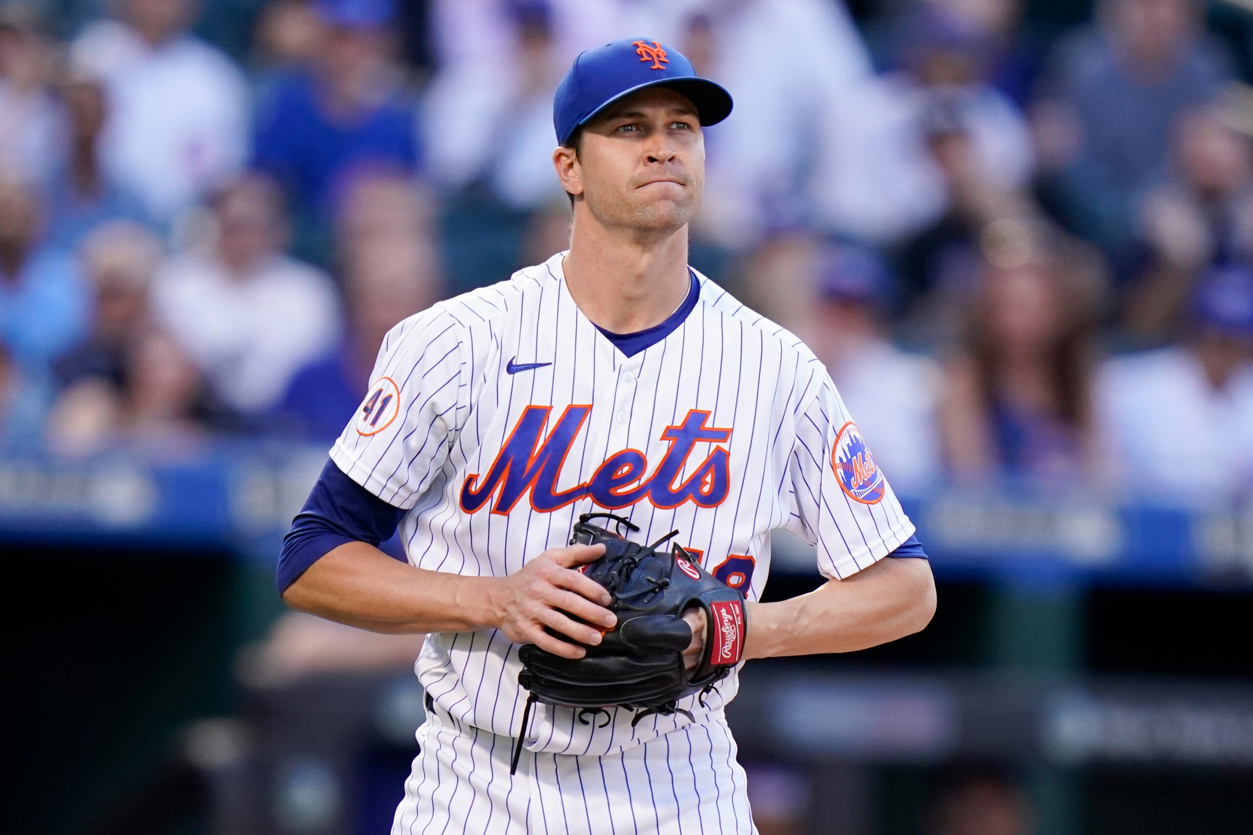 New York Mets starting pitcher Jacob deGrom reacts during the first inning of a baseball game against the Chicago Cubs Wednesday, June 16, 2021, in New York. (AP Photo/Frank Franklin II)