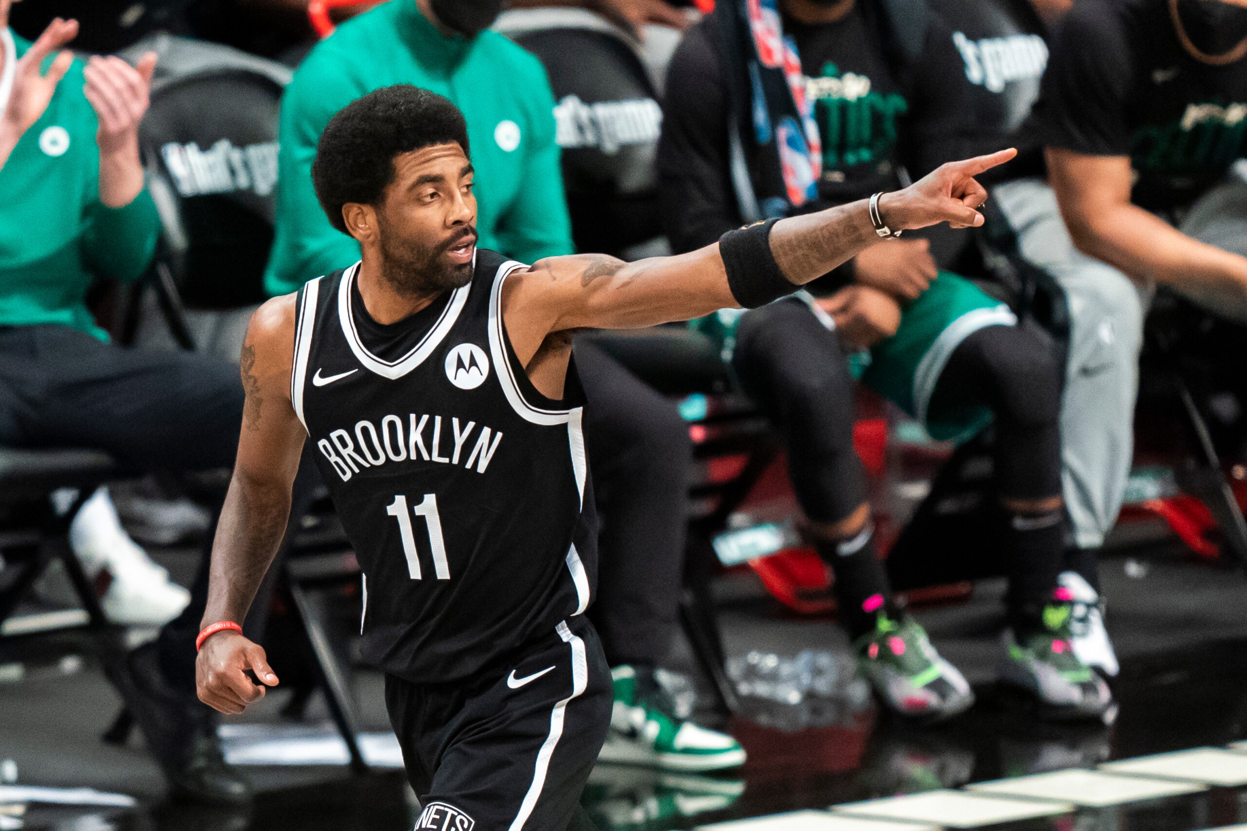 Brooklyn Nets guard Kyrie Irving (11) reacts during the first half of Game 1 of an NBA basketball first-round playoff series against the Boston Celtics Saturday, May 22, 2021, in New York. (AP Photo/Corey Sipkin)