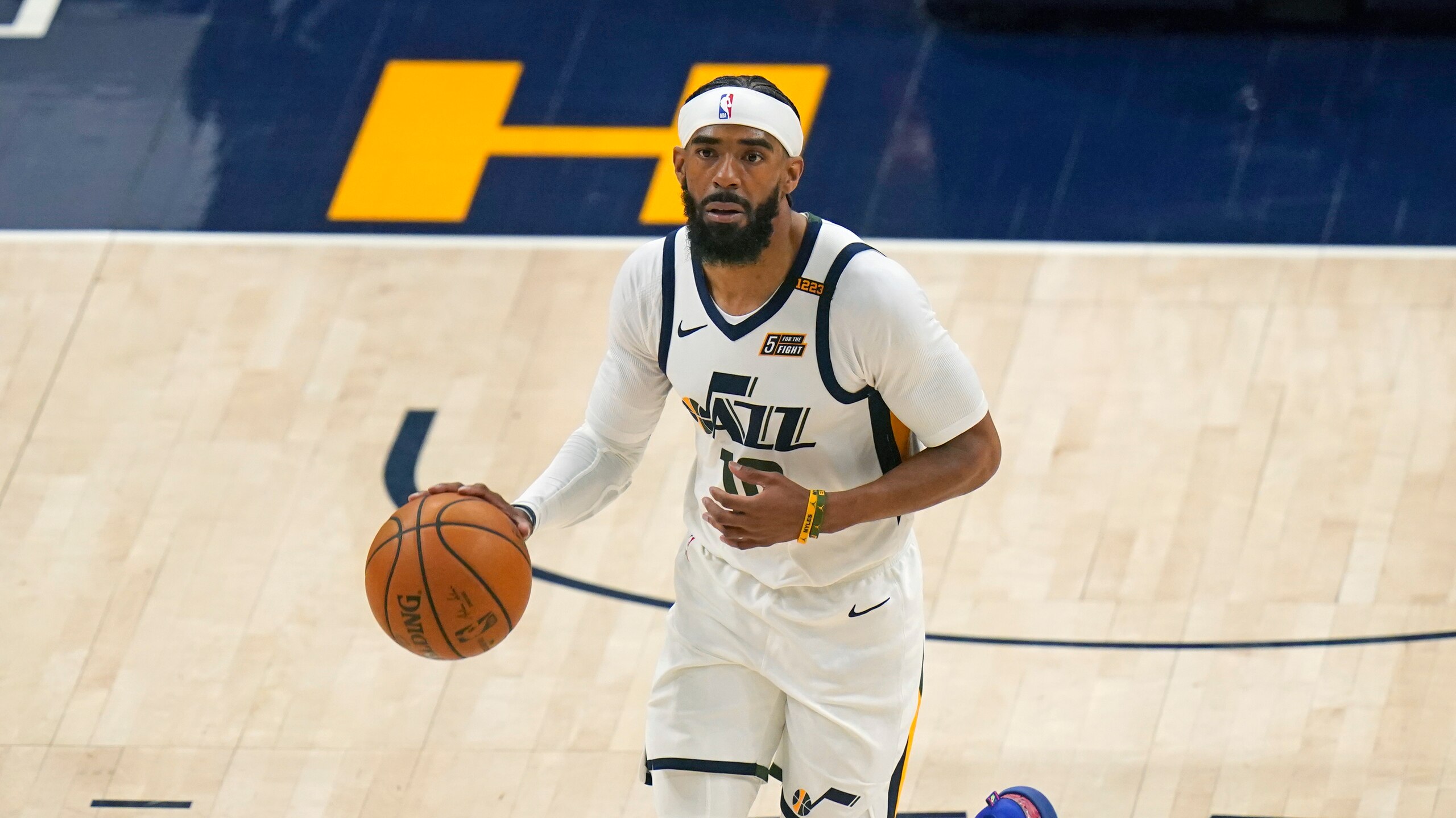 Utah Jazz guard Mike Conley brings the ball up court during the second half of Game 1 of their NBA basketball first-round playoff series against the Memphis Grizzlies Sunday, May 23, 2021, in Salt Lake City. (AP Photo/Rick Bowmer)
