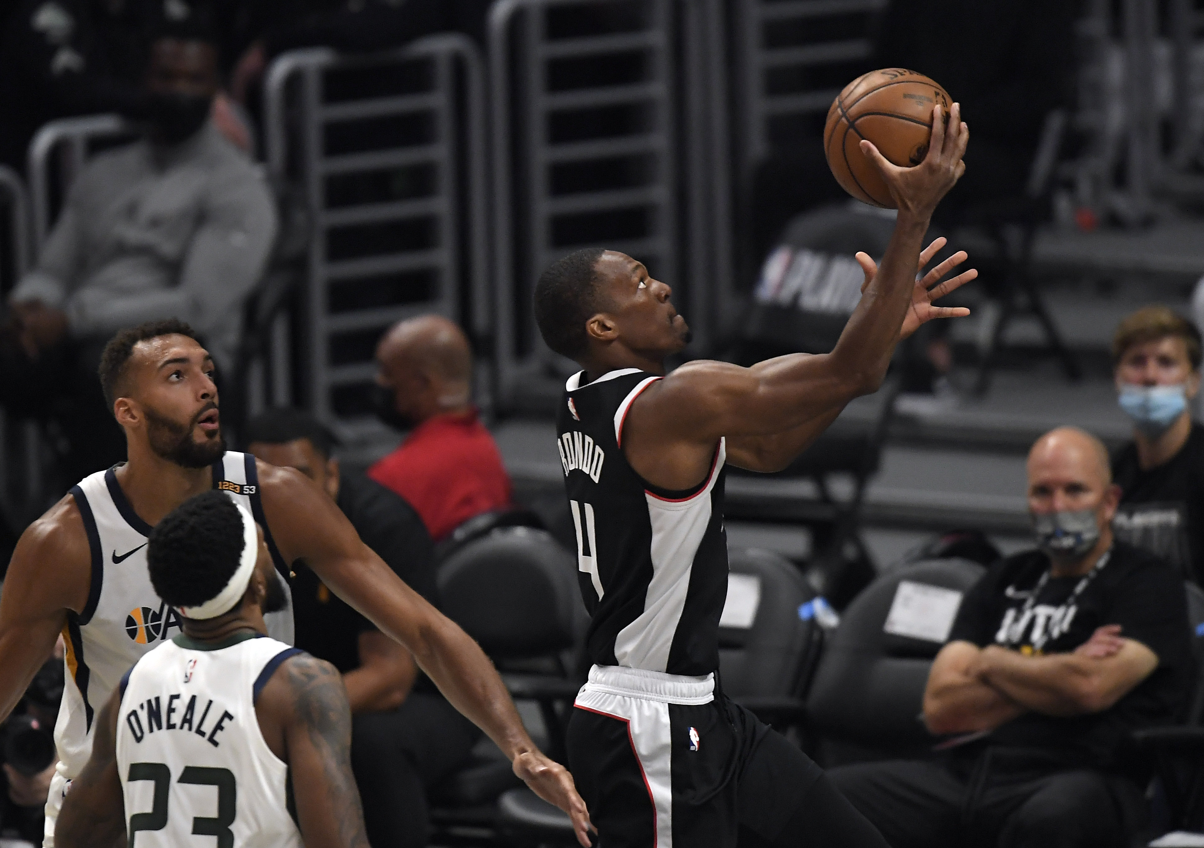 LOS ANGELES, CA - JUNE 18: Rajon Rondo #4 of the Los Angeles Clippers scores a basket against Rudy Gobert #27 of the Utah Jazz during the first half in Game Six of the Western Conference second-round playoff series at Staples Center on June 18, 2021 in Los Angeles, California. NOTE TO USER: User expressly acknowledges and agrees that, by downloading and or using this photograph, User is consenting to the terms and conditions of the Getty Images License Agreement. (Photo by Kevork Djansezian/Getty Images)