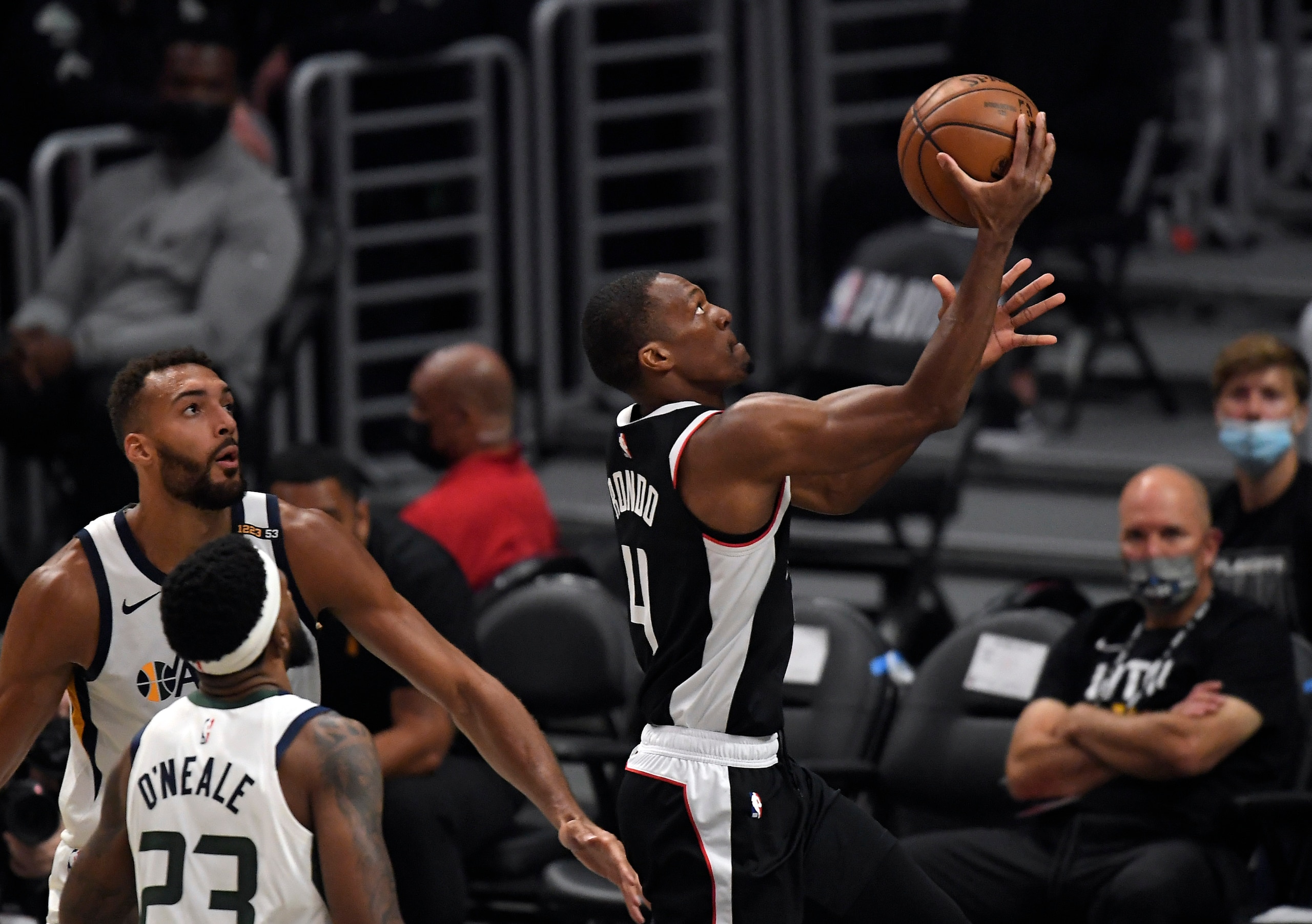 LOS ANGELES, CA - JUNE 18: Rajon Rondo #4 of the Los Angeles Clippers scores a basket against Rudy Gobert #27 of the Utah Jazz during the first half in Game Six of the Western Conference second-round playoff series at Staples Center on June 18, 2021 in Los Angeles, California. NOTE TO USER: User expressly acknowledges and agrees that, by downloading and or using this photograph, User is consenting to the terms and conditions of the Getty Images License Agreement. (Photo by Kevork Djansezian/Getty Images) LOS ANGELES, CA - JUNE 18: Rajon Rondo #4 of the Los Angeles Clippers scores a basket against Rudy Gobert #27 of the Utah Jazz during the first half in Game Six of the Western Conference second-round playoff series at Staples Center on June 18, 2021 in Los Angeles, California. NOTE TO USER: User expressly acknowledges and agrees that, by downloading and or using this photograph, User is consenting to the terms and conditions of the Getty Images License Agreement. (Photo by Kevork Djansezian/Getty Images)